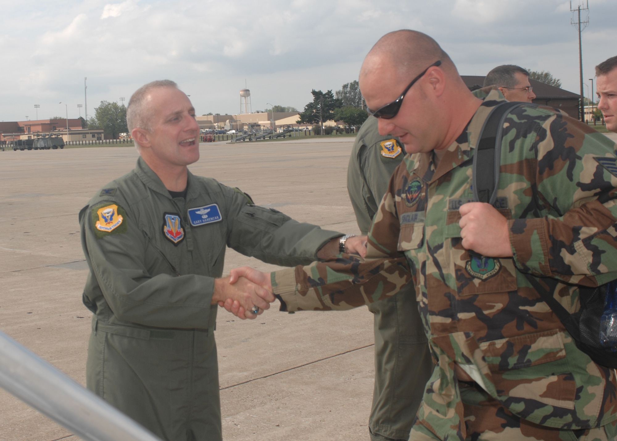 WHITEMAN AIR FORCE BASE, Mo. – Col. Garrett Harencak, 509th Bomb Wing commander, says goodbye to Tech. Sgt. Jeremy Sinclair, 509th Munitions Squadron, as 509th BW Airmen prepare to deploy Oct. 7 in support of the continued bomber presence at Andersen Air Force Base, Guam. The continued bomber presence is designed to enhance regional security and demonstrate U.S. commitment to the Western Pacific. (U.S. Air Force photo/Tech. Sgt. Samuel A. Park)