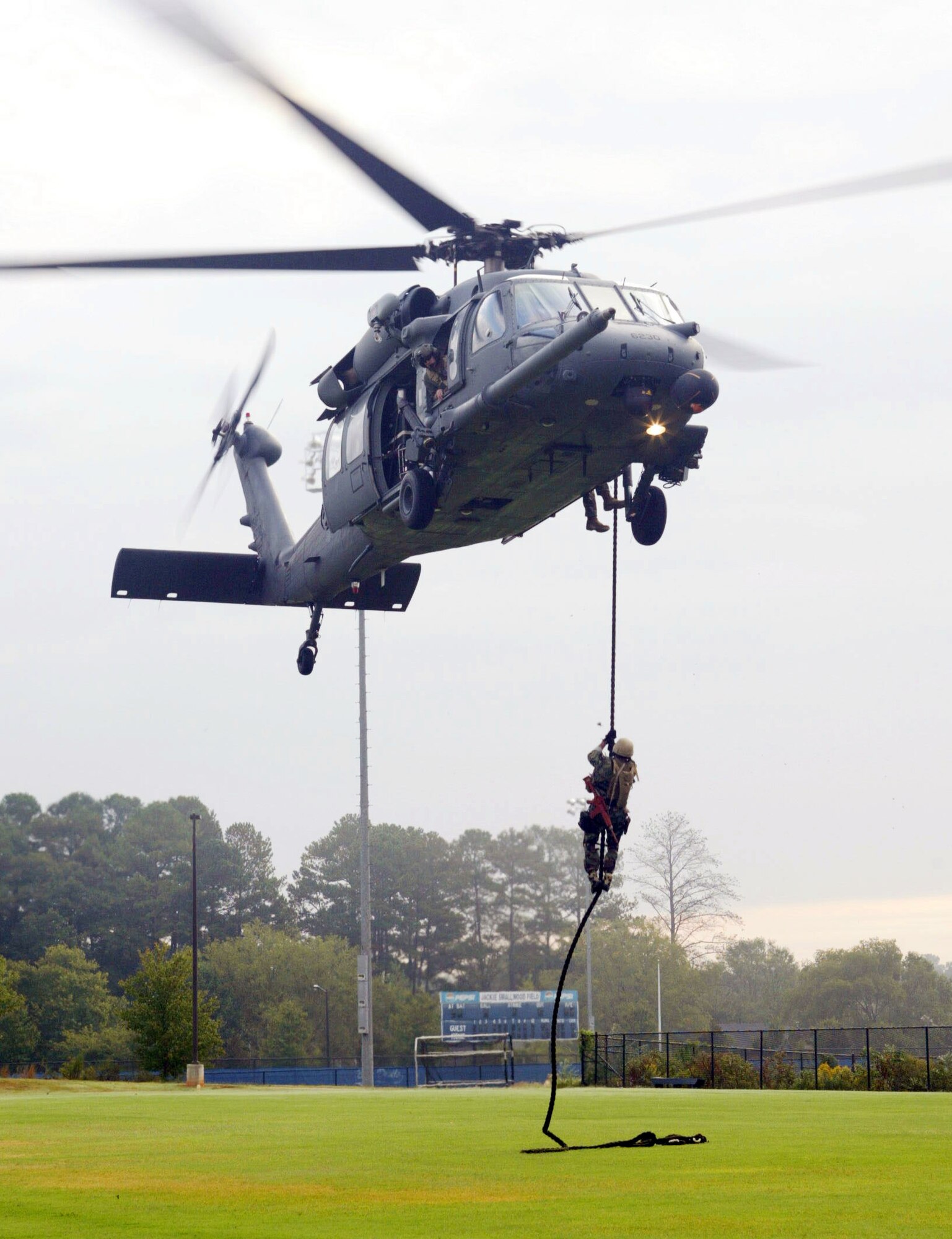Marietta High School hosted the first "High School Drop-In" event during Air Force Week Atlanta, Oct. 8-14. The helicopter pararescue demonstration was performed by the 301st Rescue Squadron, Patrick AFB, Fla. The aircraft used in the demonstration is the HH-60 Pavehawk. "This demonstration was an alternate infiltration/exfiltration exercise," said Master Sgt. Steve Johnson, the Pavehawk's flight engineer. The exercise demonstrated the capability of the pararescueman to retrieve a survivor by hoist. The rescue demonstration is part of the  Air Force "Heritage to Horizons" 60th Anniversary. (U.S. Air Force photo/Don Peek)