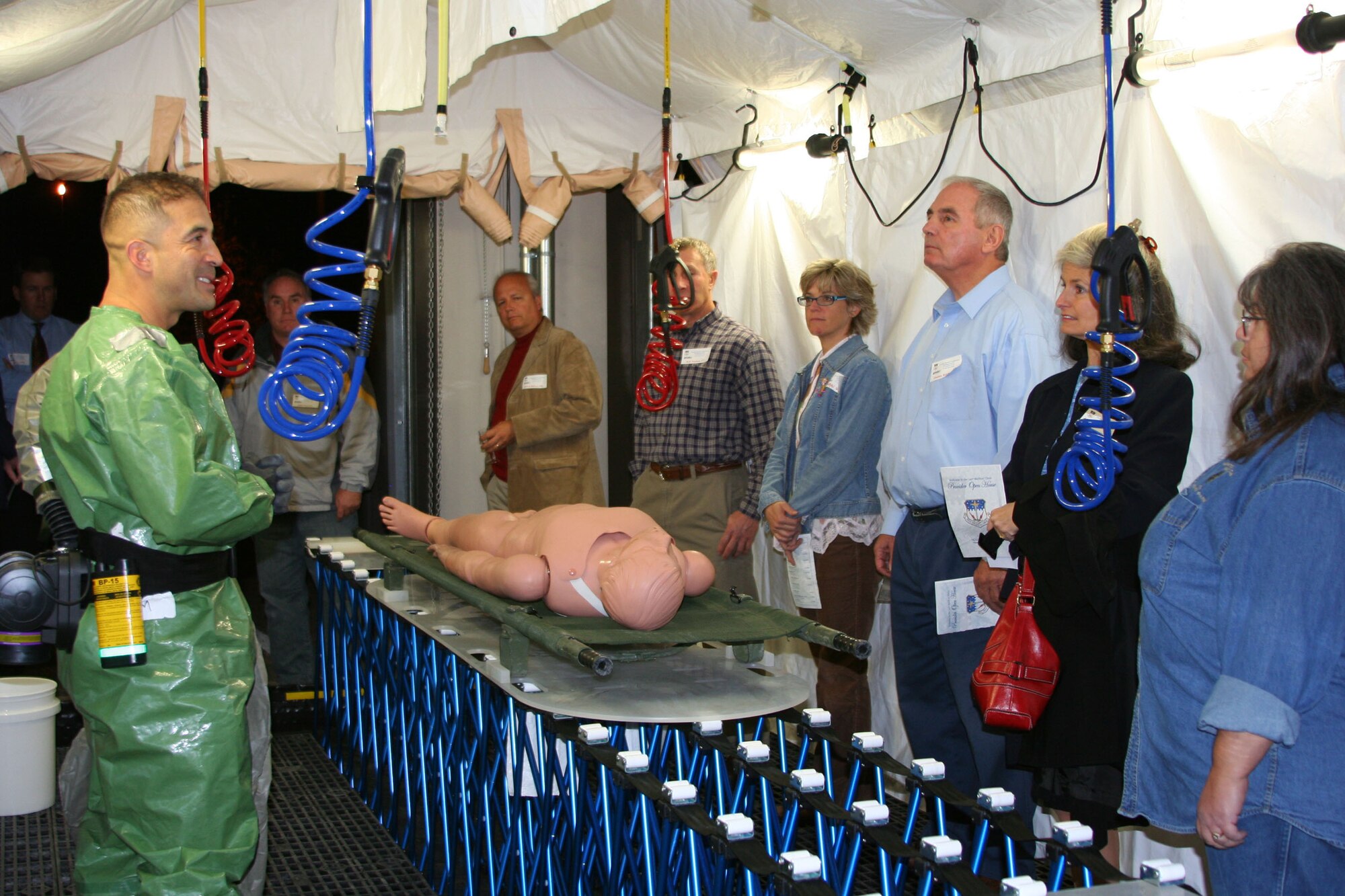 Capt. Fernando Santana, 341st Medical Support Squadron decontamination team chief, explains how to decontaminate a “victim” at the clinic at the Malmstrom Air Force Base, Mont., to a group of local medical providers Oct. 4. The 341st Medical Group held an open house for medical staff  working on- and off-base so they could meet one another and tour the facilities offered at Malmstrom. The open house was the first of its kind here for the 341st MDG. (U.S. Air Force photo/Senior Airman Eydie Sakura).