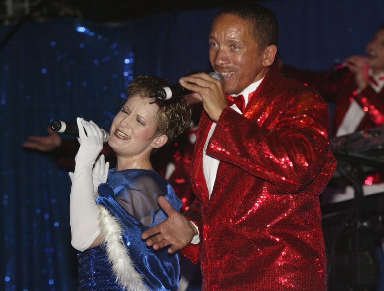 Senior Airman April Vollm and Tech. Sgt. Keith Martin of Tops in Blue sing and dance for the audience at Starr's Mill High School in Fayetteville, Ga. Oct. 7. As the expeditionary entertainment showcase of the Air Force, Tops in Blue gave the special performance as part of Air Force Week Atlanta.  The event, which runs Oct. 8-12, is designed to inform the American public, civic leaders and service members about the Air Force's mission, 60-year heritage, capabilities and role in the Global War on Terror.  Atlanta was chosen as one of six locations to host the week throughout the country this year. (U.S. Air Force photo/Don Peek)