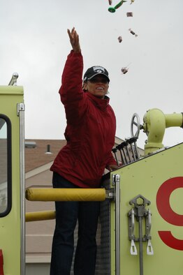 Col. Renita Alexander, 28th Mission Support Group commander throws candy to the crowd who came out for the Fire Prevention Week Parade. The parade was followed by an open house at the Fire Department. This year's theme is Practice your Escape Plan.
(U.S. Air Force photo/Airman 1st Class Kimberly Moore Limrick)