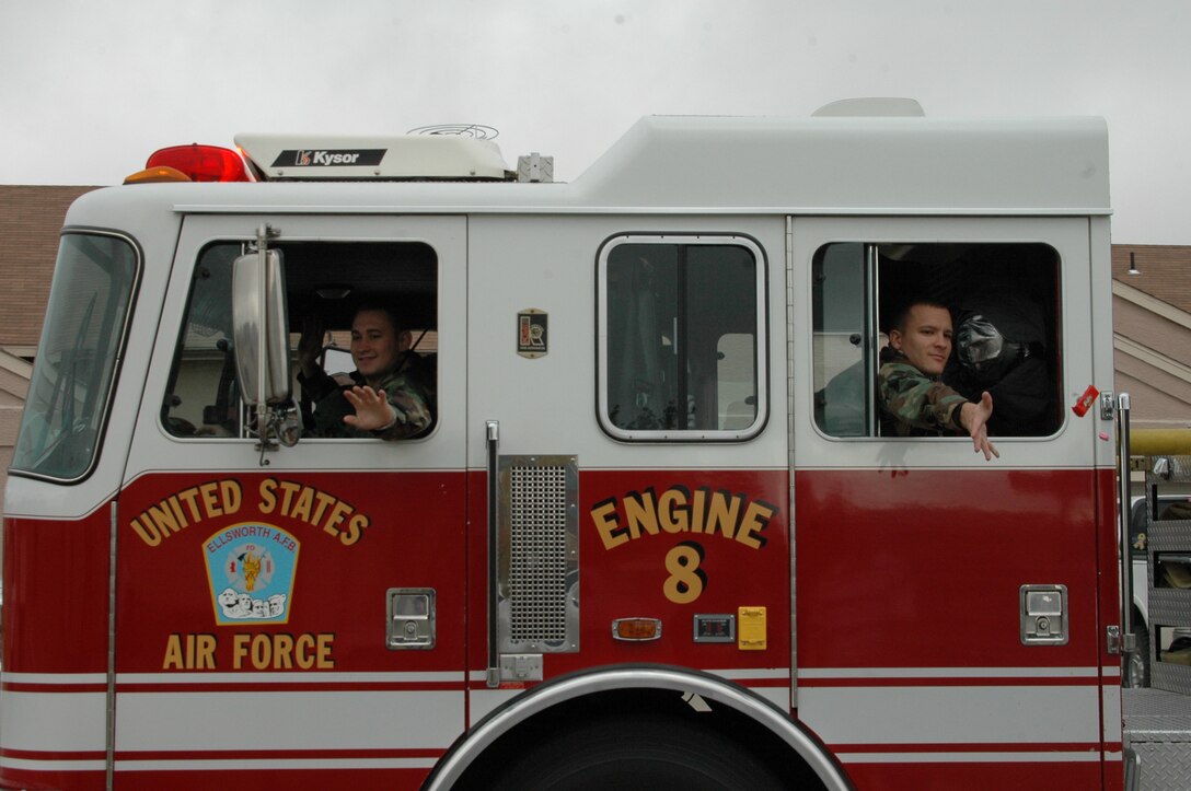 Ellsworth Firefighters throw candy to the crowd that came out for the Fire Prevention Week Parade. The parade was followed by an open house at the Fire Department. This year's theme is Practice your Escape Plan.
(U.S. Air Force photo/Airman 1st Class Kimberly Moore Limrick)