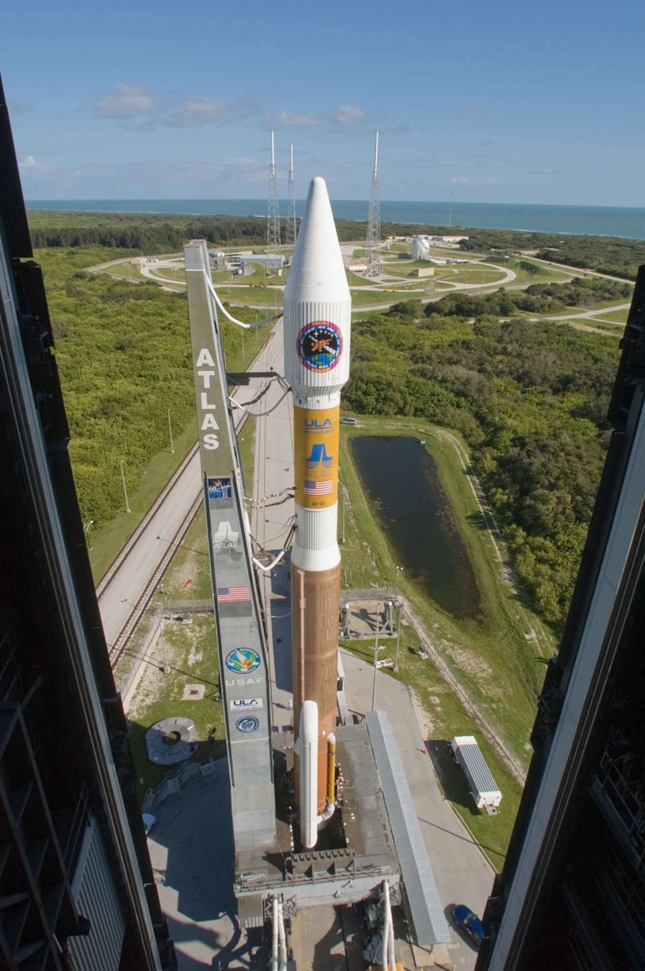 The Atlas V rocket with the Wideband Global SATCOM satellite rolls out to Space Launch Complex-41 from its Vertical Integration Building at 10 a.m., Oct. 9.  The Atlas V was rolled to the pad in preparation for the launch of WGS-1 set for Oct. 10 with at launch window of 8:22-9:33 p.m. from Cape Canaveral Air Force Station, Florida. (Photo by Karl Ronstrom, ULA) 

