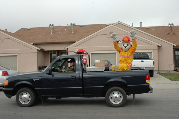Sparky waves to the crowd during the Fire Prevention Week Parade. The parade was followed by an open house at the Fire Department. This year's theme is Practice your Escape Plan.
(U.S. Air Force photo/Airman 1st Class Kimberly Moore Limrick)