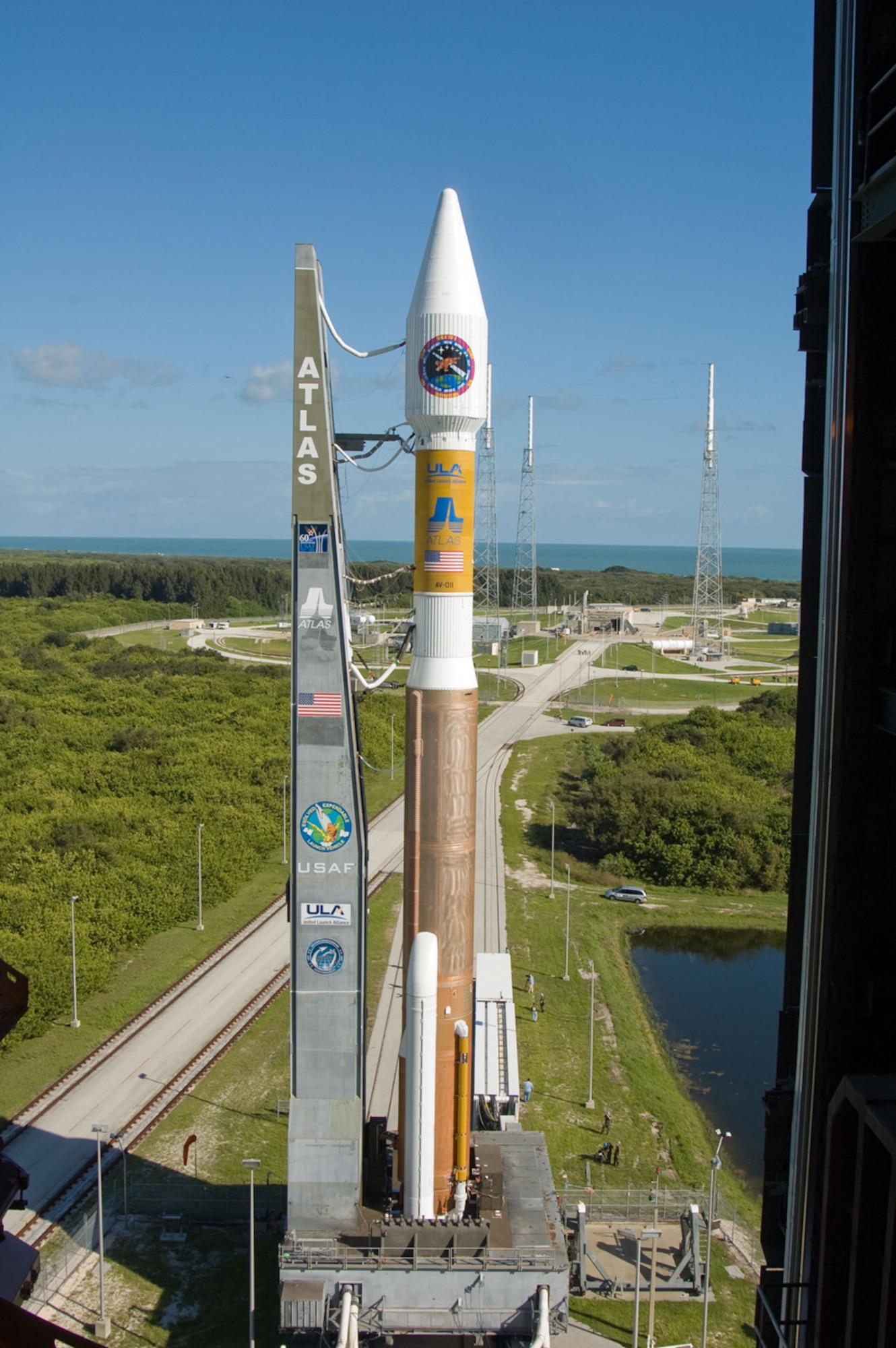 The Atlas V rocket with the Wideband Global SATCOM satellite rolls out to Space Launch Complex-41 from its Vertical Integration Building at 10 a.m., Oct. 9.  The Atlas V was rolled to the pad in preparation for the launch of WGS-1 set for Oct. 10 with at launch window of 8:22-9:33 p.m. from Cape Canaveral Air Force Station, Florida. (Photo by Pat Corkery, ULA)

