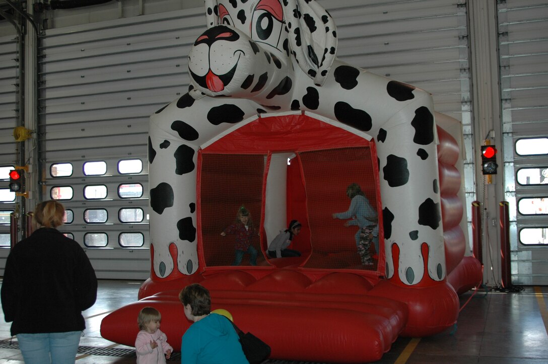 Children bounce around in an inflatable toy during an open house at the fire department Oct. 6. The open house was preceeded by a Fire Prevention Week Parade. This year's theme is Practice your Escape Plan.
(U.S. Air Force photo/Airman 1st Class Kimberly Moore Limrick)