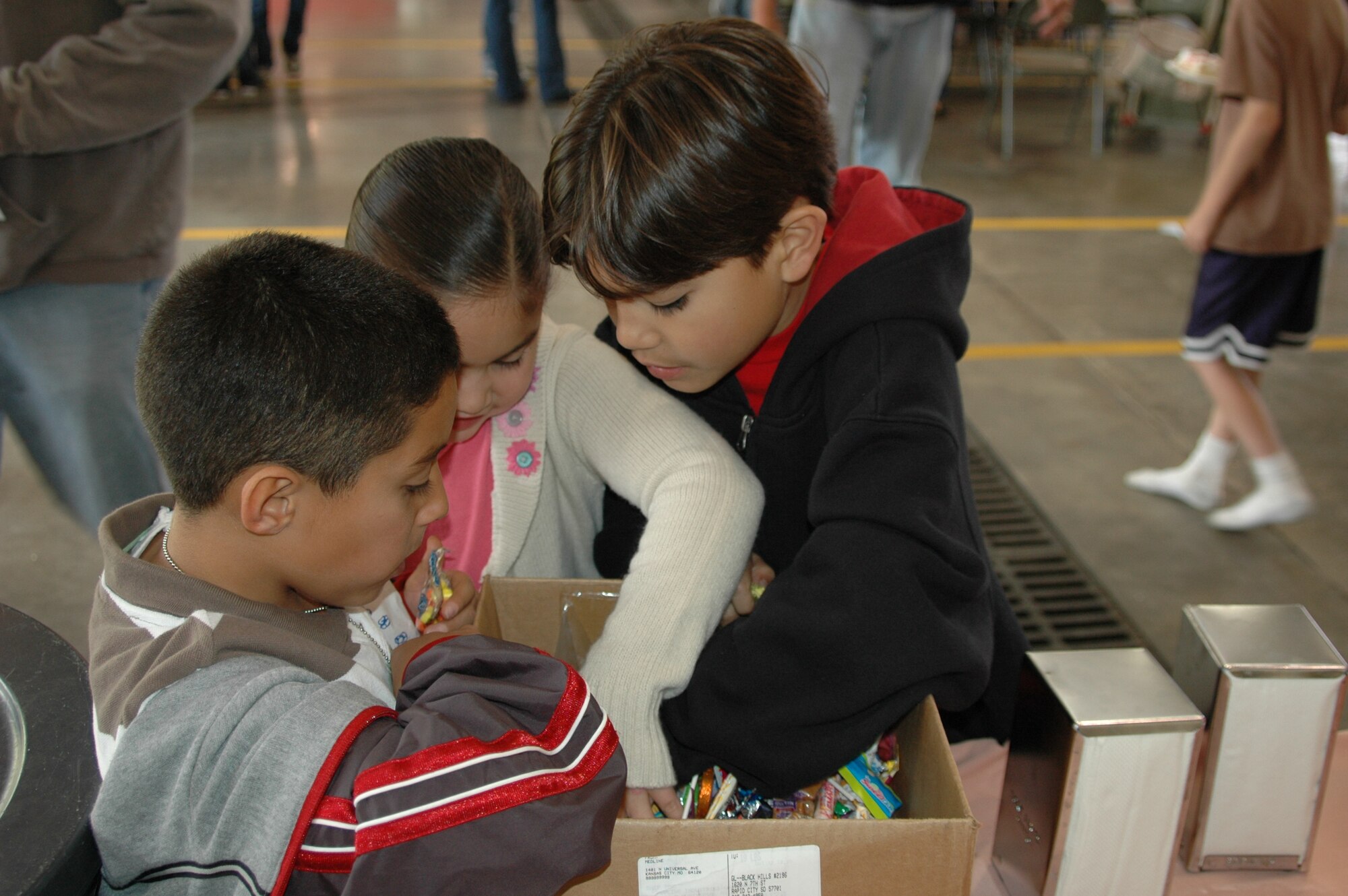 Children rummage through a box of candy choosing their favorites during an open house at the fire department Oct. 6. The open house was preceeded by a Fire Prevention Week Parade. This year's theme is Practice your Escape Plan.
(U.S. Air Force photo/Airman 1st Class Kimberly Moore Limrick)