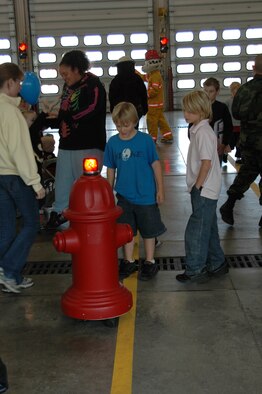 A remote controlled fire hydrant grabs the attention of many during an open house at the fire department Oct. 6. The open house was preceeded by a Fire Prevention Week Parade. This year's theme is Practice your Escape Plan.
(U.S. Air Force photo/Airman 1st Class Kimberly Moore Limrick)