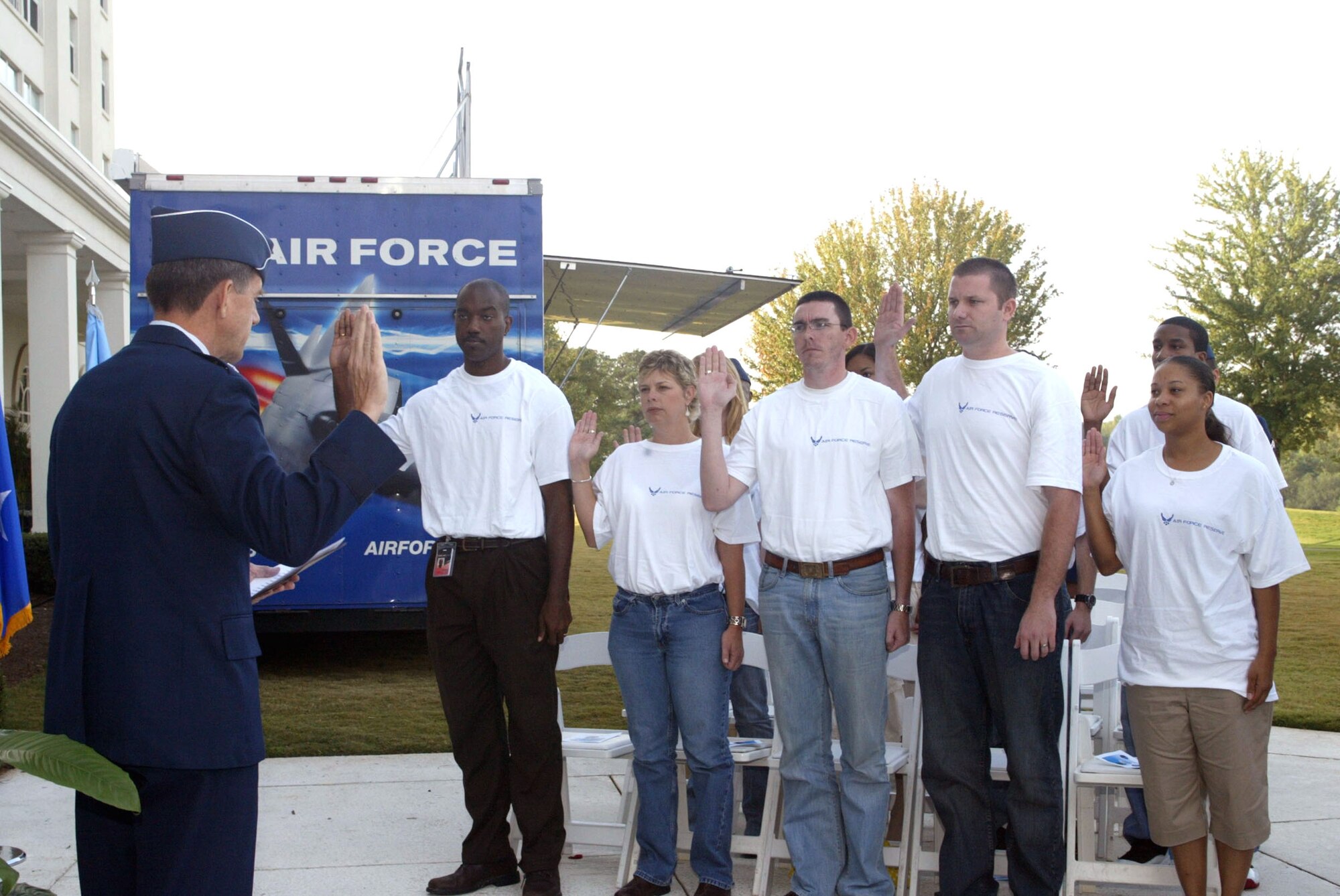Maj. Gen. Scott Hammond, Georgia Air National Guard commander, administers the oath of enlistment to nearly a dozen young adults during the Air Force Week Atlanta proclamation ceremony Oct. 8 at the Marietta Conference Center. Air Force Week Atlanta is designed to inform the American public, civic leaders and service members about the Air Force's mission, 60-year heritage, capabilities and role in the Global War on Terror. (U.S. Air Force photo/Don Peek)