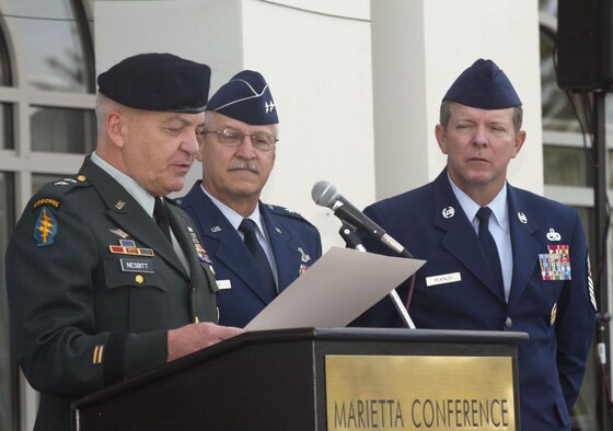 Maj. Gen. William Nesbitt, Georgia Assistant Adjutant General, reads the proclamation designating Oct. 8-14 as Air Force Week Atlanta during a ceremony at the Marietta Conference Center Oct. 8 as Maj. Gen. Martin Mazick, 22nd Air Force commander, and Chief Master Sgt. of the Air Force Rodney McKinley look on.  Nearly 100 people attended the ceremony, which featured remarks by Georgia Congressman Phil Gingrey and an oath of enlistment for a dozen high school students.  Air Force Week is designed to inform the American public, civic leaders and service members about the Air Force's mission, 60-year heritage, capabilities and role in the Global War on Terror.   