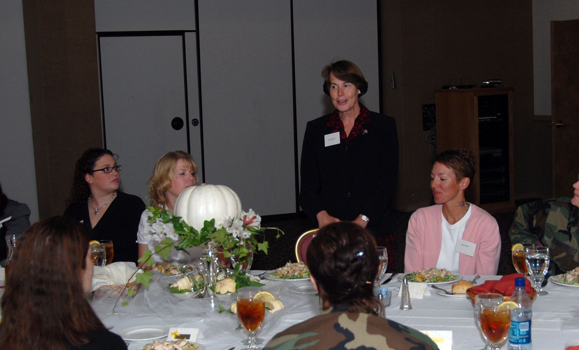 Vicki Carlson (standing), wife of Air Force Materiel Command commander Gen. Bruce Carlson, speaks at a deployed spouses luncheon here Oct. 3. General and Mrs. Carlson were visiting Edwards for the Air Force Flight Test Center change of command ceremony. (Photo by Senior Airman Jason Hernandez)