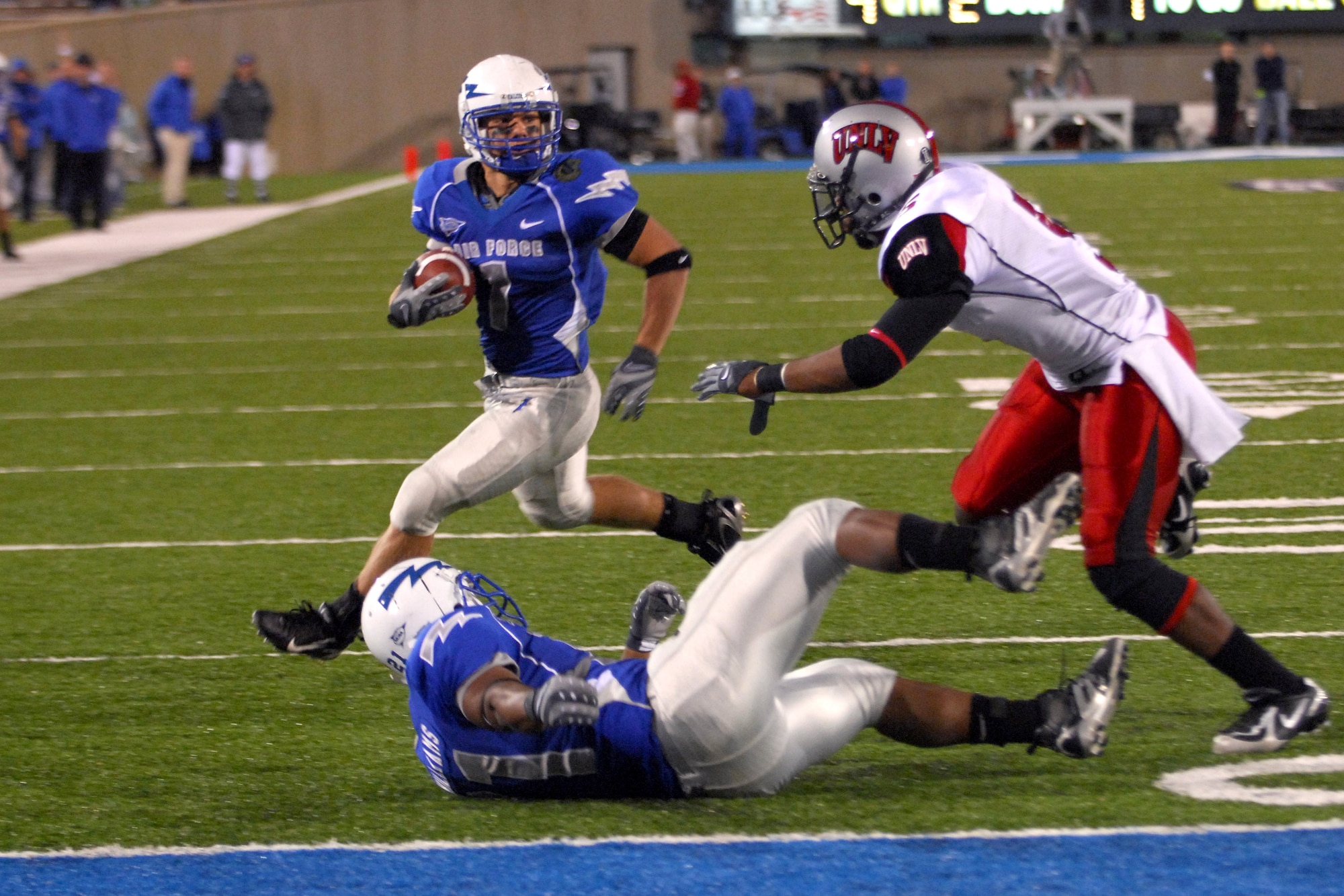 Air Force senior Chad Hall gets a block by Ryan Williams on UNLV's Mil'Von James to score on an 8-yard touchdown run Oct. 6 in the bluesuiters 31-14 win over the Rebels at Falcon Stadium. (U.S. Air Force photo/Dave Armer) 
