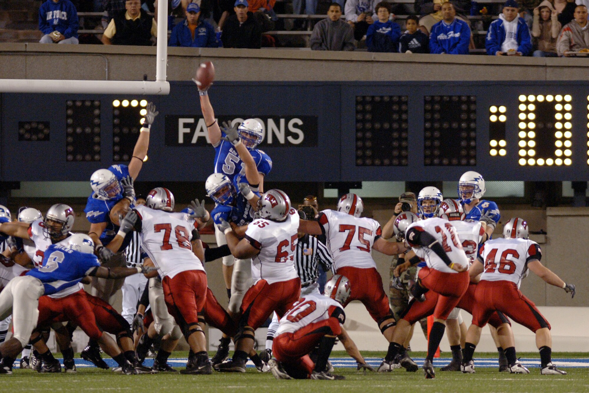 Air Force linebacker Aaron Shanor reaches in vain to block a field goal attempt by UNLV's Sergio Aguayo, 10, during the Falcons 31-14 win at Falcon Stadium Oct. 6. Shanor registered 10 tackles on defense, including four solo. (U.S. Air Force photo/Dave Armer) 