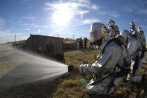 MINOT AIR FORCE BASE, N.D. -- Fire Fighters from the 5th Civil Engineering Squadron Fire Department participate in a fire training exercise here Oct. 1. Fire Prevention week is Oct. 7 to 13. (U.S Air Force Photo by Senior Airman Stacy Moless)