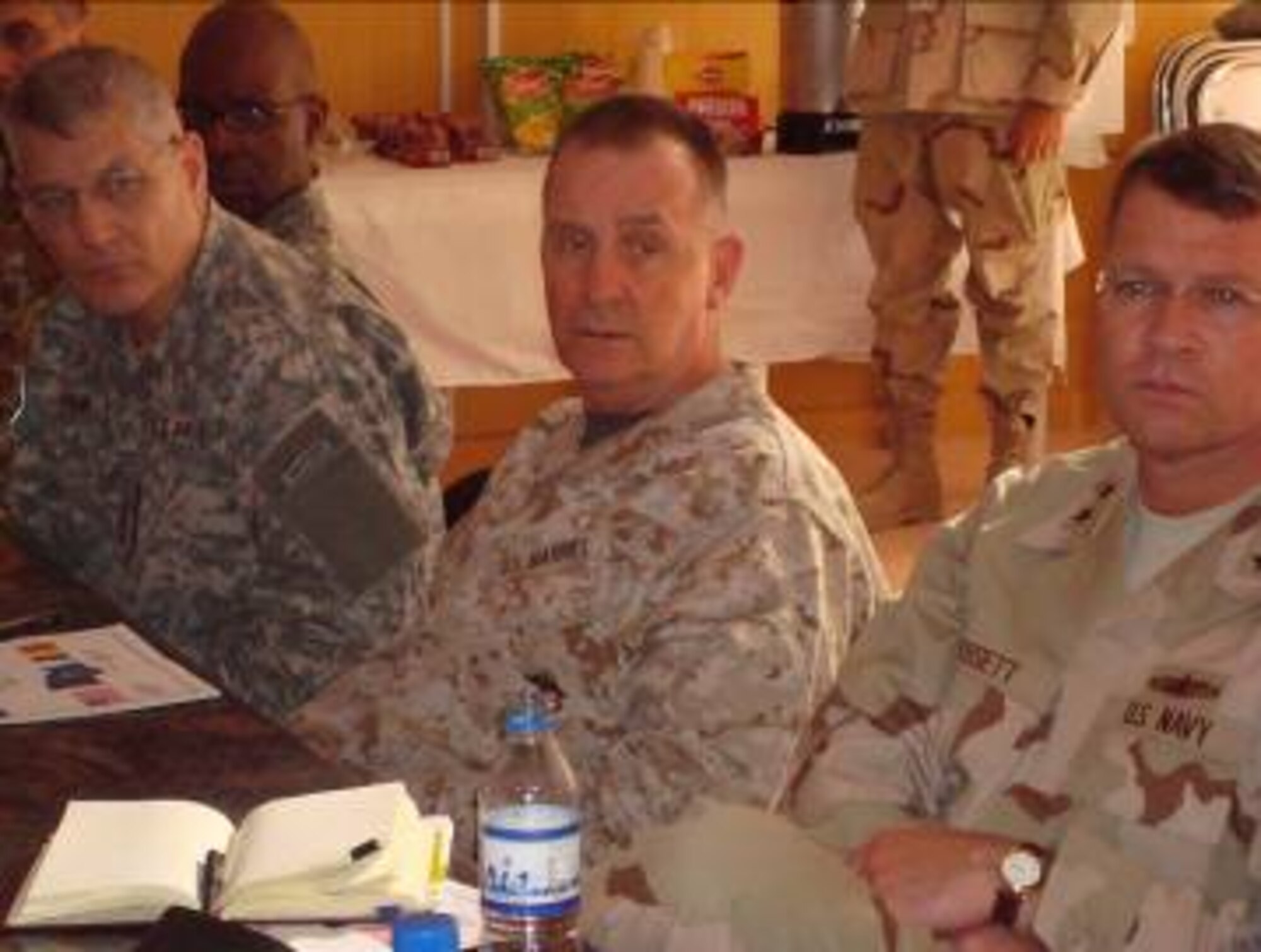 “Eight stars” from the Chairman of the Joint Chiefs of Staff office in Washington, D.C., receive a briefing from U.S. military and civilian leaders here Oct. 9 before meeting with the governor of Zabul Province.  The generals are (l to r) Lt. Gen. Carter Ham (Army), Director for Operations; Lt. Gen. John Sattler (Marines), Director for Strategic Plans and Policy; and Rear Adm. David Dorsett (Navy), Director for Intelligence.  (Air Force photo by Capt. Bob Everdeen)