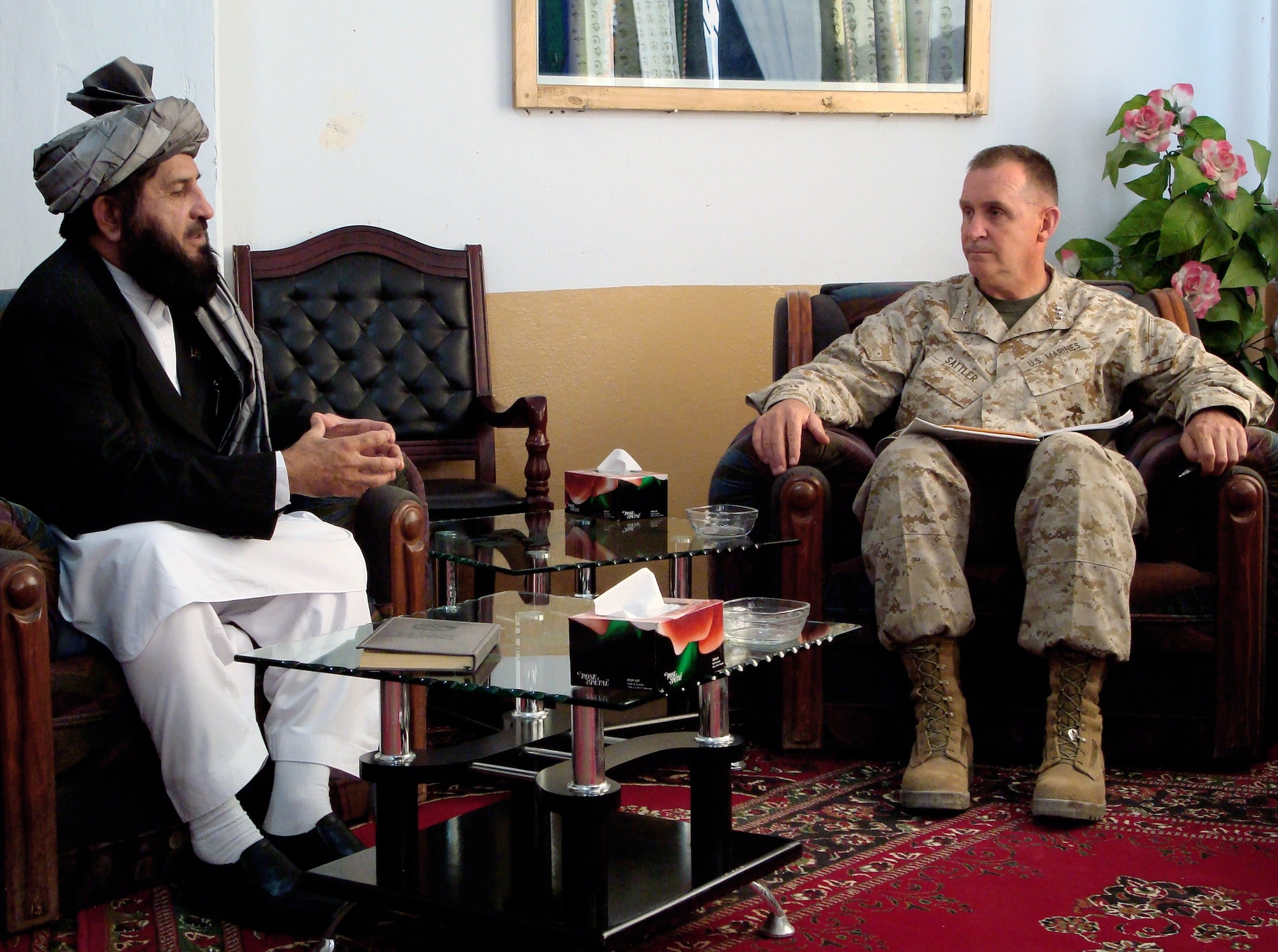 Zabul Province Governor Delbar Jan Arman meets with Marine Lt. Gen. John Sattler Oct. 9 in Qalat, Afghanistan, on the sixth anniversary of the U.S.-led invasion against the Taliban. General Sattler is the Joint Chiefs Strategic Plans and Policy director. (U.S. Air Force photo/Capt. Bob Everdeen) 
