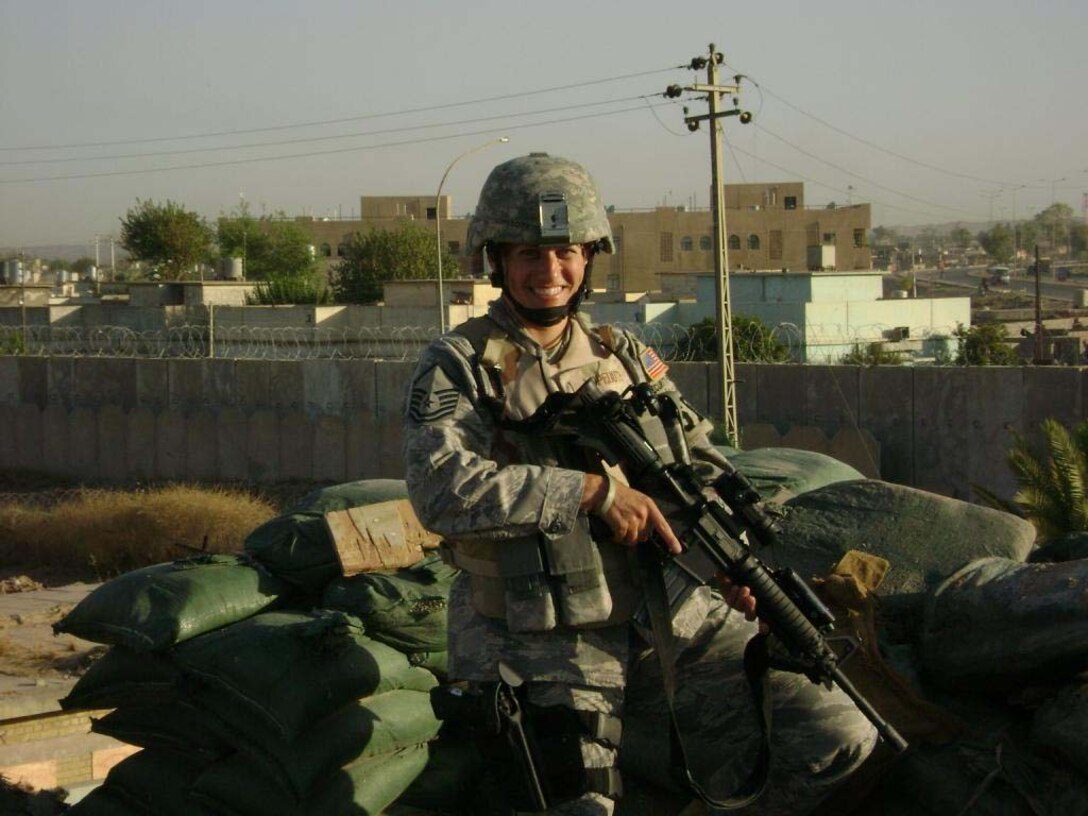 KIRKUK AIR BASE, IRAQ--Master Sgt. Wendy Lopedote stands in front of the city of Kirkuk while on patrol there. Sergeant Lopedote is one of more than forty security forces deployed from the 916th Air Refueling Wing, Air Force Reserve, located at Seymour Johnson Air Force Base, N.C.