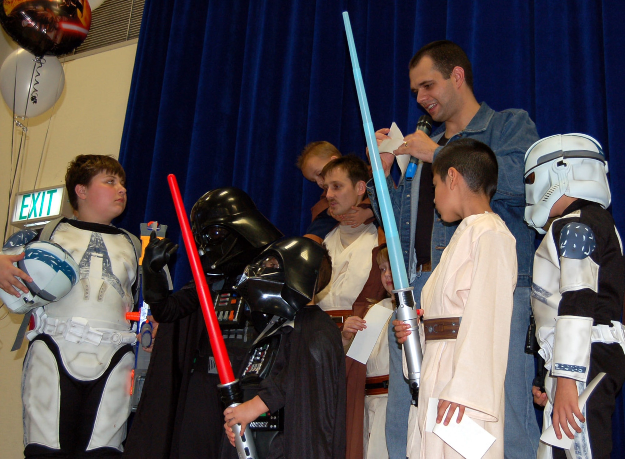 SPANGDAHLEM AIR BASE, Germany – Senior Airman Jarrod Garceau, 52nd Medical Operations Squadron and Star Wars convention coordinator, assigns costume contest members numbers so spectators can vote for the best costume. (U.S. Air Force photo/Staff Sgt. Tammie Moore)  