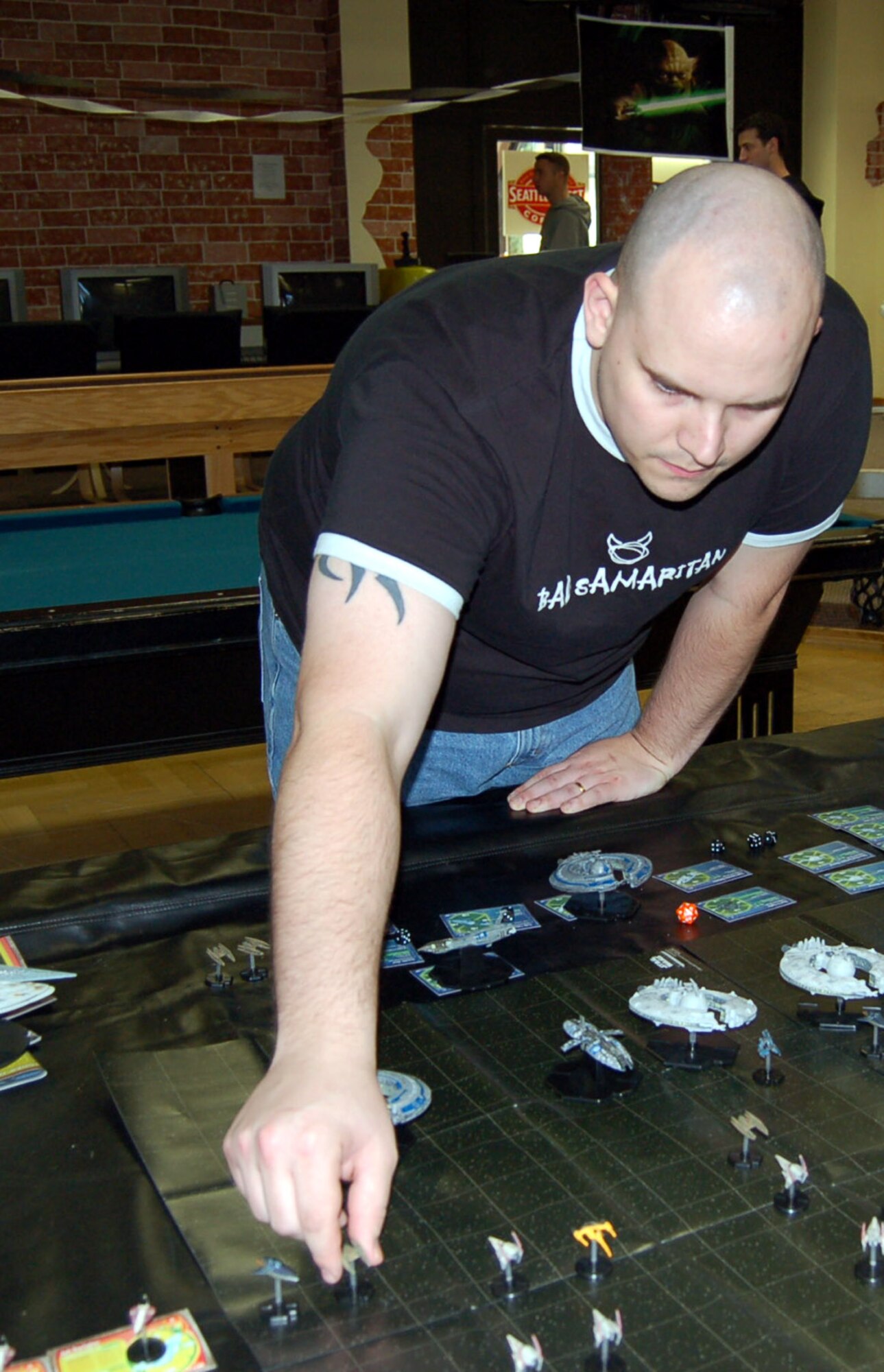 SPANGDAHLEM AIR BASE, Germany -- Andreas Cross, spouse of Staff Sgt. Michelle Cross, 702nd Munitions Support Squadron, makes his move as he plays a miniature Star Wars game. Mr. Cross was one of more than 350 Sabers who attended a Star Wars convention here celebrating the 30th anniversary of the movie’s release Oct. 6. (U.S. Air Force photo/Staff Sgt. Tammie Moore)  