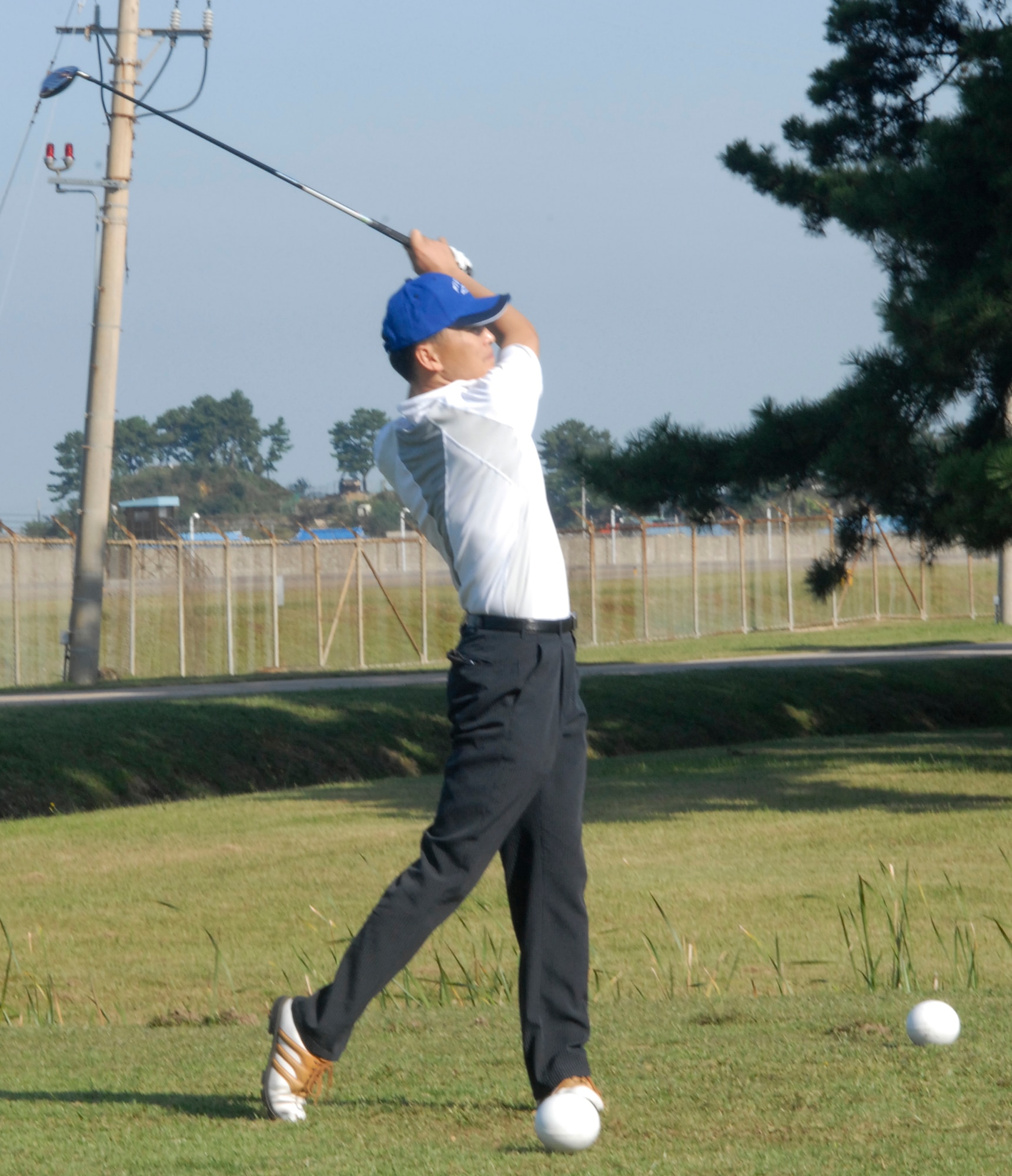 KUNSAN AIR BASE, South Korea - Republic of Korea Air Force Chief Master Sgt. Giyeol Kim, tees off during the U.S. Air Force and Republic of Korea Air Force chief’s golf event here Oct. 6.  Six USAF chiefs and 6 ROKAF chiefs met for a friendly game of golf to exchange communication and build friendship. (U.S. Air Force photo/Staff Sgt. Darcie Ibidapo)
