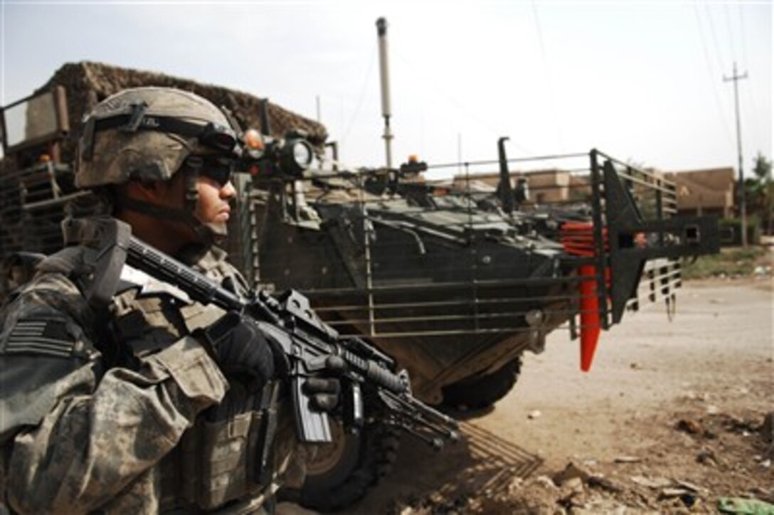A U.S. Army soldier with 2nd Stryker Cavalry Regiment provides security while on patrol in Baghdad, Iraq, on Oct. 7, 2007.  