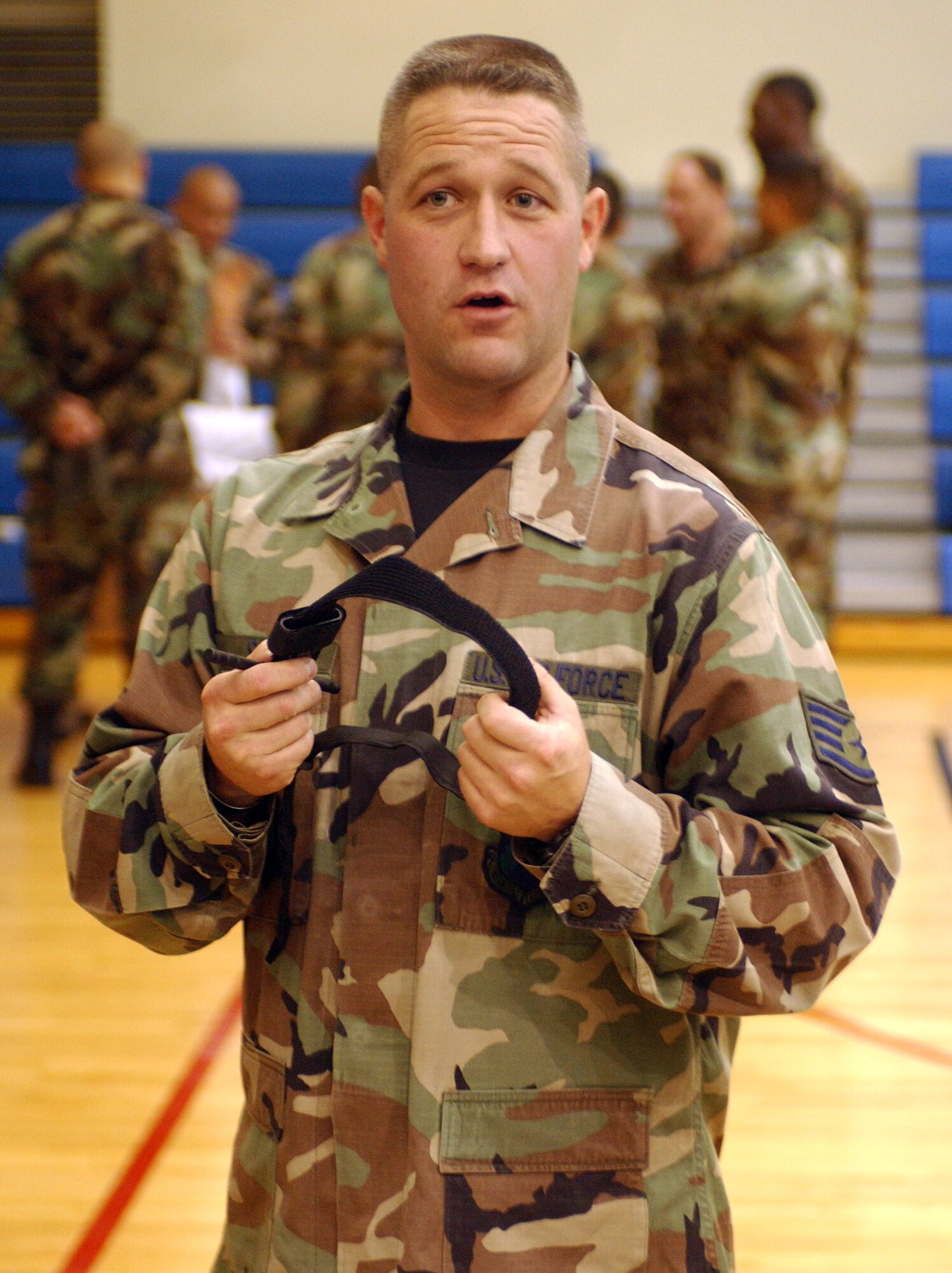 KUNSAN AIR BASE, South Korea -- Staff Sgt. Robert Seid, 8th Logistics Readiness Squadron Self Aid and Buddy Care instructor, explains the combat application tourniquet to a group of Airmen here Oct. 10.  The SABC class was part of the Ability to Survive and Operate Rodeo conducted during the Wolf War Day to prepare newly assigned Airmen for potential combat operations. (U.S. Air Force photo/Senior Airman Steven R. Doty)                              