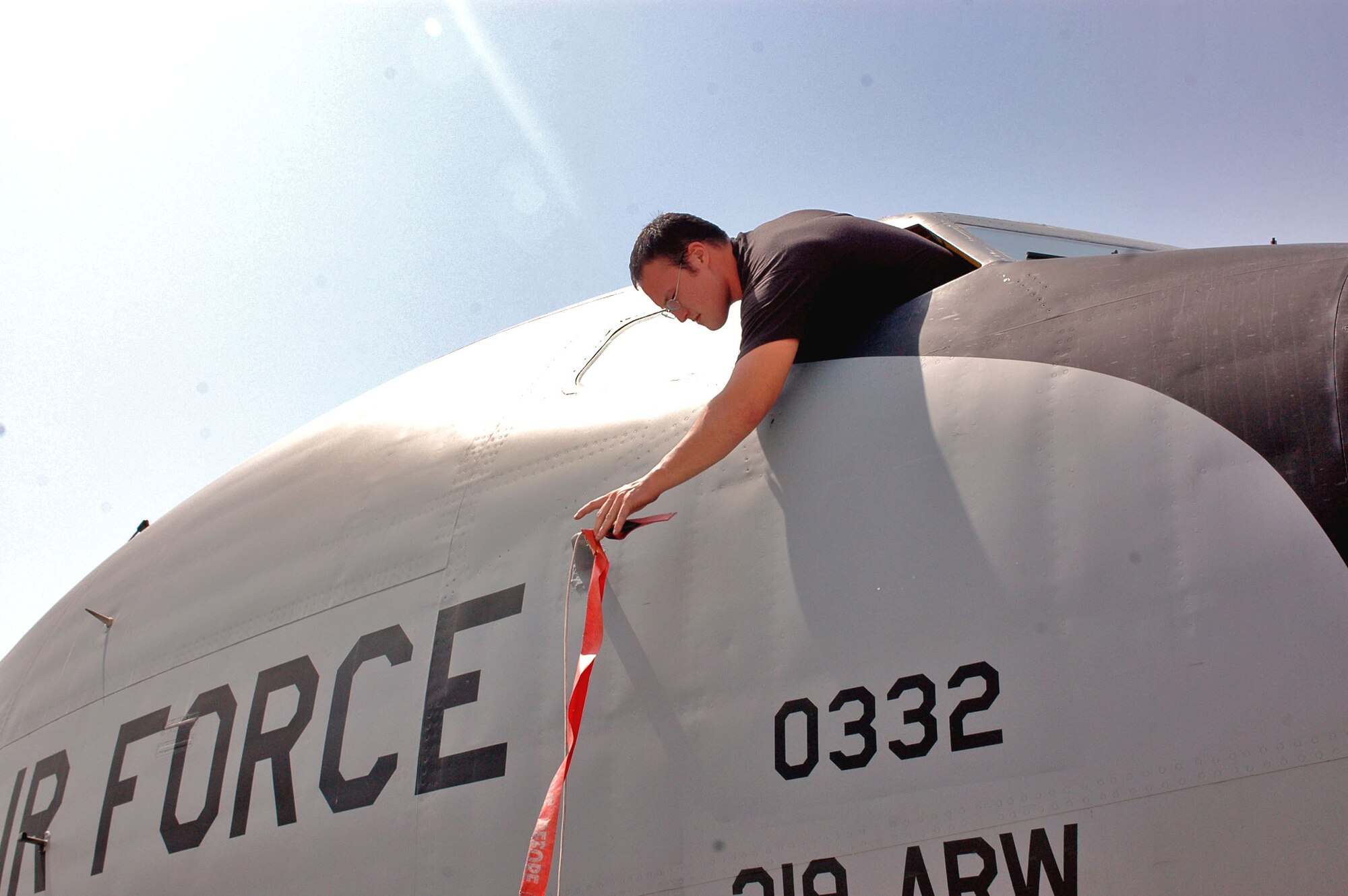 Senior Airman Mike McGovern places a cover on an air data probe of a KC-135 Stratotanker in Southwest Asia. The cover prevents foreign objects from damaging and plugging the probe so pilots receive accurate information. Airman McGovern is deployed to the 340th Aircraft Maintenance Unit from Grand Forks Air Force Base, N.D. (U.S. Air Force photo/Staff Sgt. Jason Barebo) 