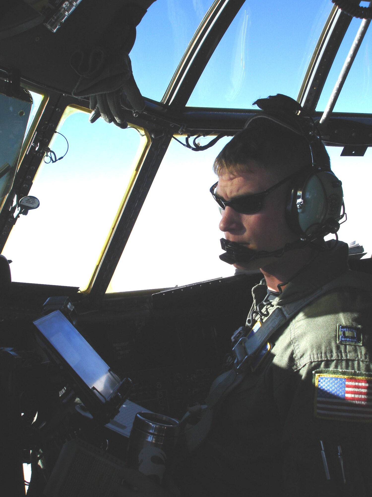 A 30th Airlift Squadron co-pilot trains as a member of the Air Force's first active associate unit. The unit activated July 1, 2006, at the Cheyenne Air National Guard Base and is due to deploy to Balad Air Base, Iraq, in October. The unit embodies the total force concept and places active-duty Airmen with a Guard unit to share aircraft, supplies and infrastructure. (U.S. Air Force photo/Lt. Col. Steven Hopkins)