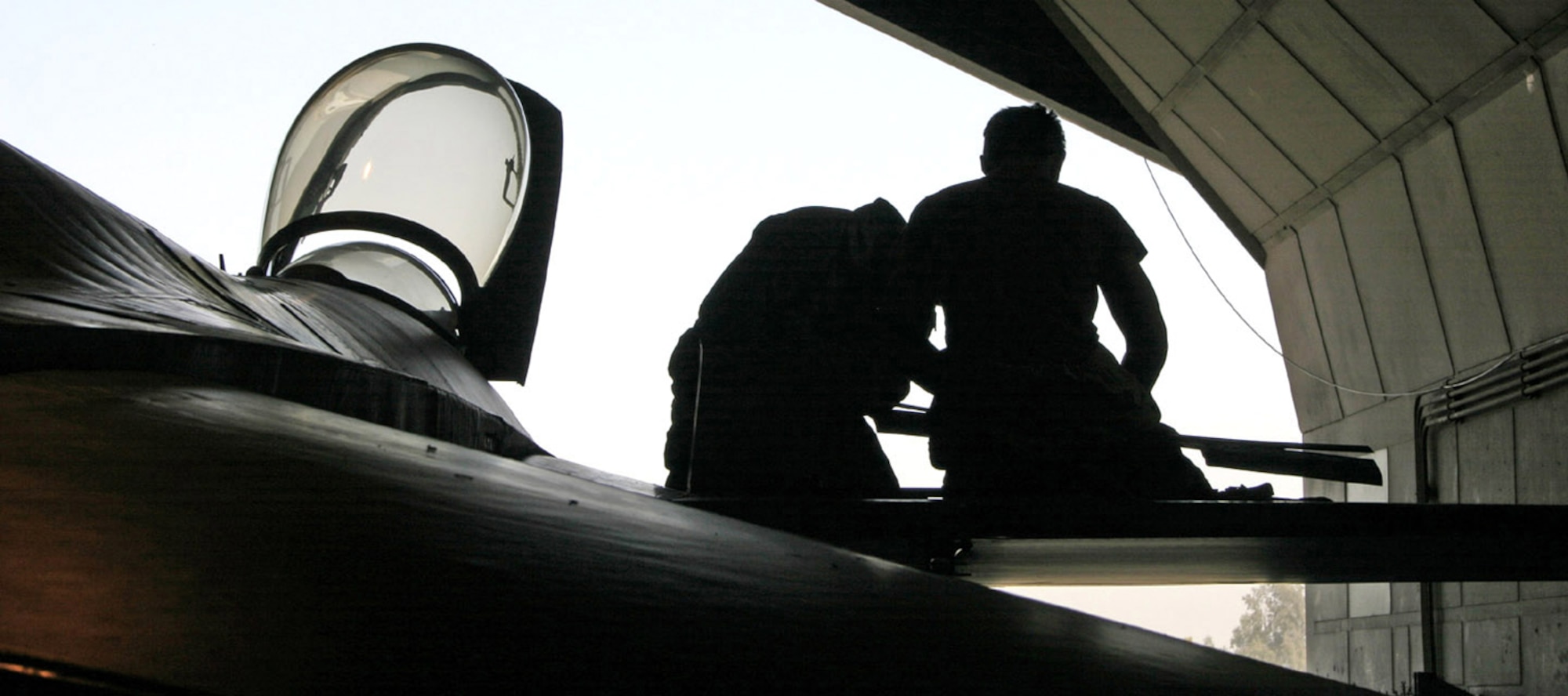 Maintainers at Balad Air Base, Iraq, work on an Air Force aircraft to keep it ready to support the coalition mission. Coalition aircraft fly hundreds of missions in support of Operation Enduring Freedom and Operation Iraqi Freedom. (U.S. Air Force photo/Staff Sgt. Adam Bradford)
