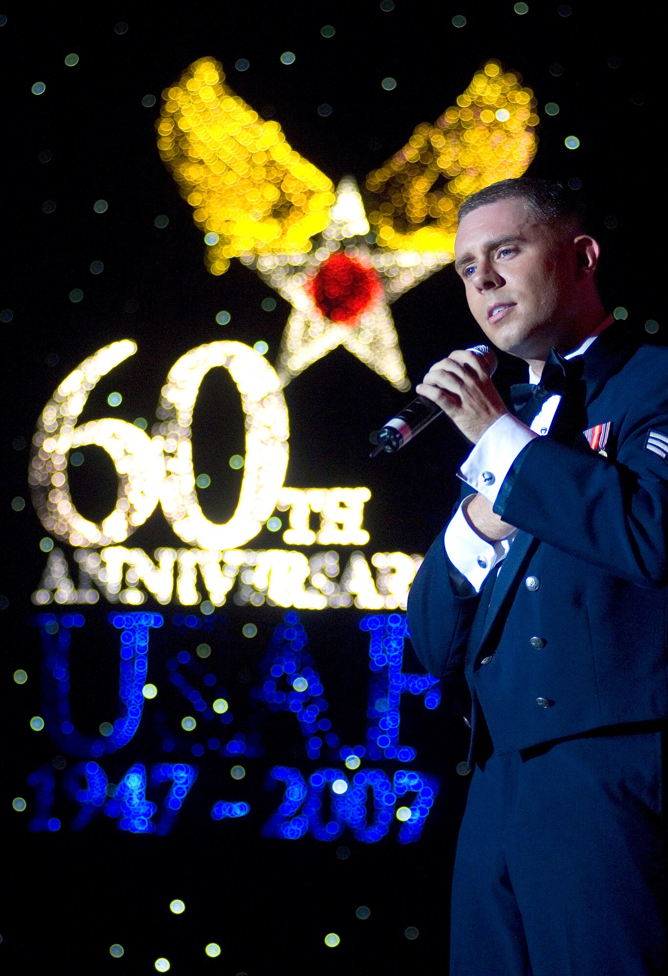 Senior Airman Nicholas Amari performs a song honoring the families of Airmen serving in deployed locations during a Tops in Blue musical tribute Oct. 9 in Mableton, Ga. Tops In Blue was in Georgia as part of Air Force Week Atlanta. (U.S. Air Force photo/Staff Sgt. Bennie J. Davis III)