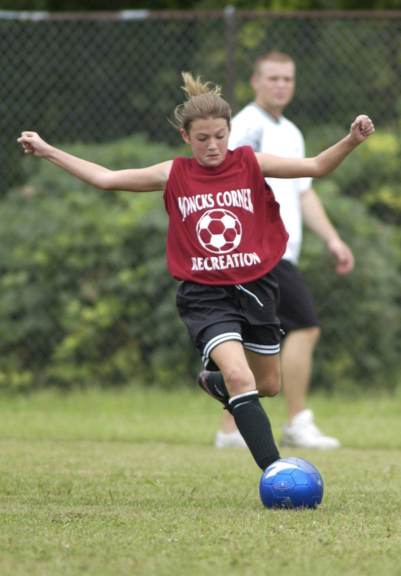 Gracen Moraux, 11, of the Moncks Corner Cosmos, gets ready to drill the ball past the Charleston AFB 11 to 12-yr-old team, Saturday on Charleston AFB. (U.S. Air Force Photo/Tech. Sgt. Paul Kilgallon) 