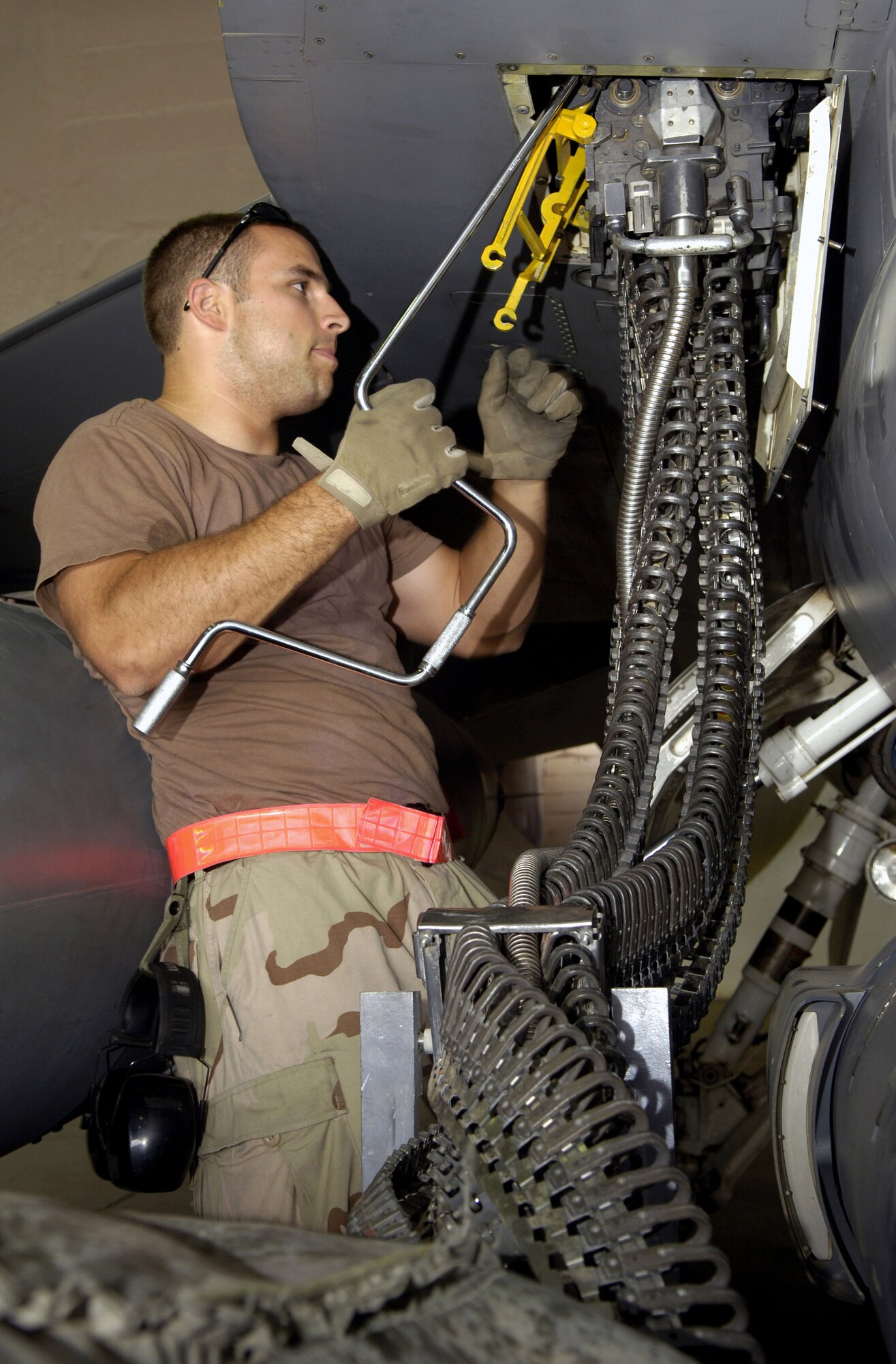 Senior Airman Zachary Eason, a weapons mechanic for the 332nd Expeditionary Aircraft Maintenance Squadron at Balad Air Base, Iraq, removes 20 mm rounds from an F-16 Fighting Falcon.  Removing munitions from the aircraft helps maintainers prevent accidents and safely accomplish the mission. (U.S. Air Force photo/Senior Airman Travis Edwards)