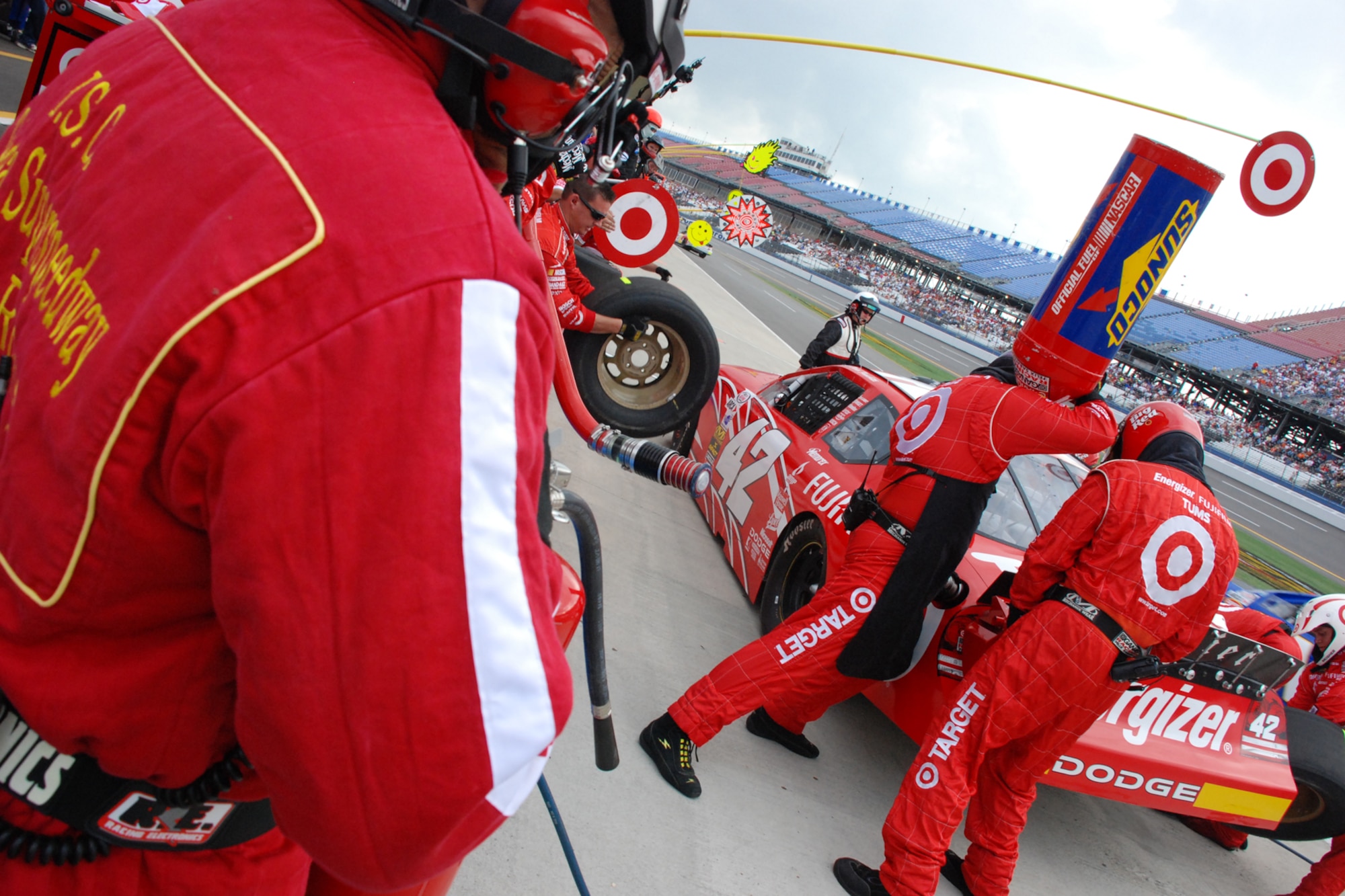 TALLADEGA, Ala. -- Tech. Sgt. Jimmy Reed, Eglin Air Force Base, Fla., firefighter and Air Force reservist at Keesler AFB, Miss., stands watch in the pits over the No. 42 Automobile Racing Club of America RE/MAX Series race Oct. 5. John Piccuito, J.R. Suddarth and Sergeant Reed, Eglin Air Force Base firefighters, are among a group of firefighters from all over the country that go to the spring and fall Talladega NASCAR races to make sure the drivers and race teams are safe. They provided safety for the Friday night Automobile Racing Club of America RE/MAX Series race, the NASCAR Craftsman Truck Series race on Saturday and the NASCAR Nextel Cup Series race on Sunday. (U.S. Air Force photo by Staff Sgt. Mike Meares)