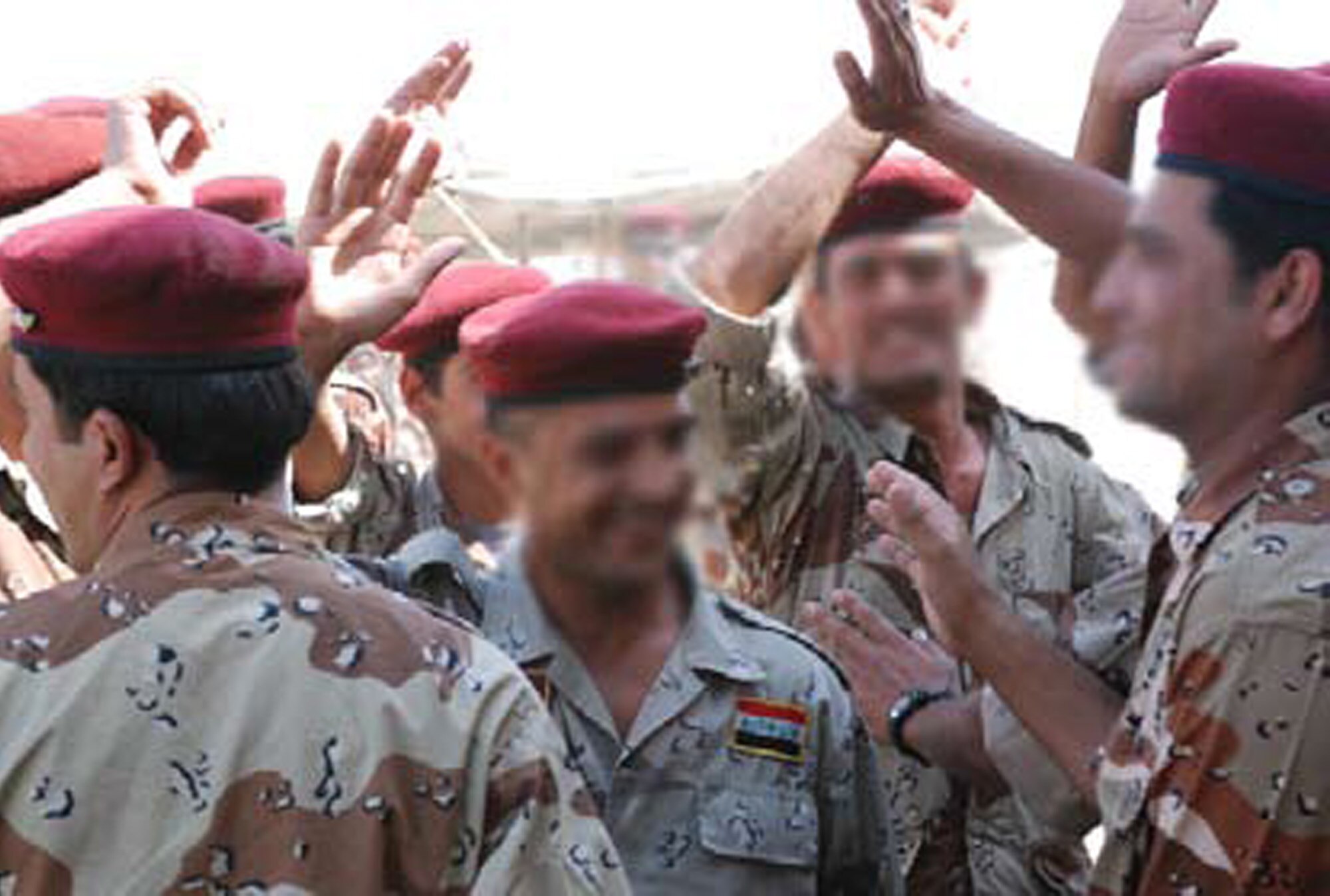 BESMAYA, Iraq -- Besmaya’s Bomb Disposal School faculty celebrate with
song and dance after the ceremony. (U.S. Air Force photo / Senior Airman Christie Putz)
