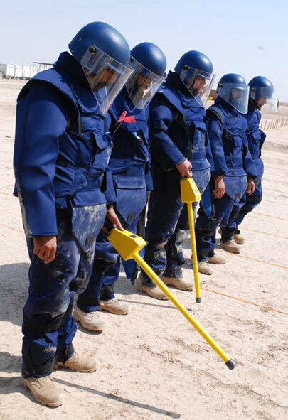 BESMAYA, Iraq -- Iraqi instructors demonstrate detection techniques after the official opening of the school. The instructors were all trained at the former bomb school site in Az Zubayr, Iraq. (U.S. Air Force photo / Senior Airman Christie Putz) 