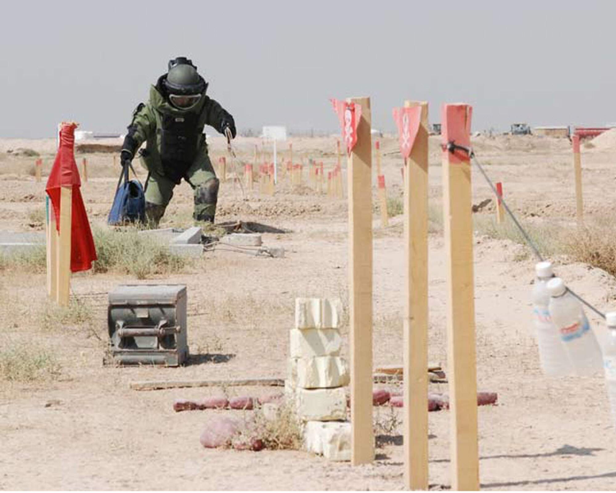 BESMAYA, Iraq -- An Iraqi instructor at the Besmaya Range Complex’s new Bomb Disposal School demonstrates ordnance disposal techniques during the school’s opening ceremony Sept. 30. The first class began Oct. 7. (U.S. Air Force photo / Senior Airman Christie Putz)