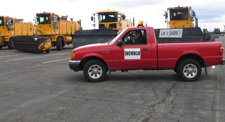 FAIRCHILD AIR FORCE BASE, Wash. – Col. Thomas Sharpy, 92nd Air Refueling Wing commander, checks out a snowplow vehicle from the 92nd Civil Engineer Sqaudron Snow Barn Oct. 5. Fairchild leadership, with help from plow operators, drove the plows around the base Oct. 5 during the annual Snow Parade, an event designed to give Fairchild a safety message: winter is coming.
(U.S. Air Force photo/Staff Sgt. Connie L. Bias)
