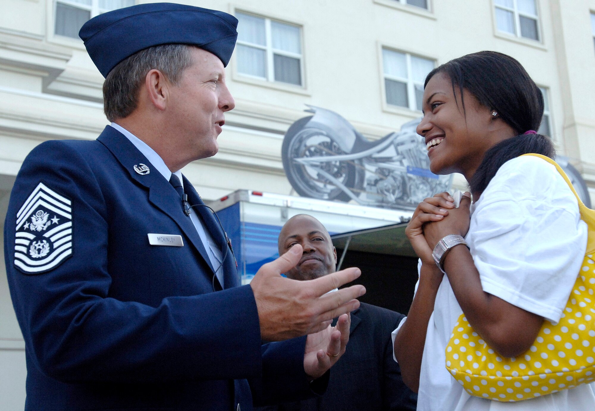 Chief Master Sergeant of the Air Force Rodney J. McKinley talks with one of the Air Force's newest recruits, Charity Pulliam, who enlisted into the Air Force during a proclamation ceremony to begin Air Force Week Atlanta Oct. 8. The Air Force Week program is meant to increase the awareness and support of the public by informing them and involving them in activities that showcase the Air Force's diverse capabilities and missions, its accomplishments and the sacrifice of its Airmen. Atlanta is one of six cities throughout the country chosen to host an Air Force Week Oct. 8 to 14. The theme for the year is "Heritage to Horizons," celebrating the 60th anniversary of the Air Force, its history and the future of the world's greatest force in air and space.  (U.S. Air Force photo/Staff Sgt. Bennie J. Davis III) 