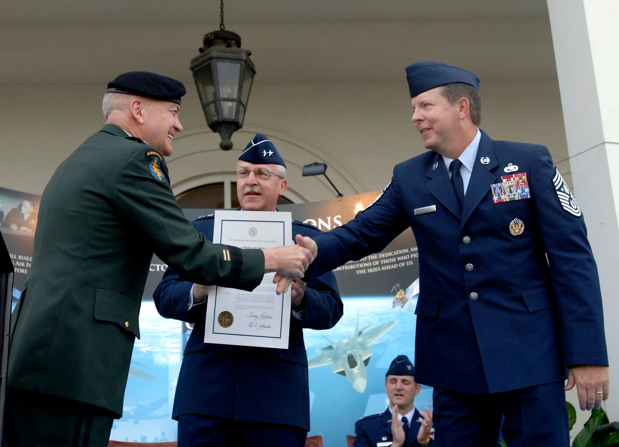 Army Maj. Gen. William T. Nesbittt congratulates Chief Master Sergeant of the Air Force Rodney J. McKinley and Maj. Gen. Martin M. Mazick on the official start to Air Force Week Atlanta Oct. 8. The Air Force Week program is meant to increase the awareness and support of the public by informing them and involving them in activities that showcase the Air Force's diverse capabilities and missions, its  accomplishments and the sacrifice of its Airmen. Atlanta is one of six cities throughout the country chosen to host an Air Force Week Oct. 8 to 14. The theme for the year is "Heritage to Horizons," celebrating the 60th anniversary of the Air Force, its history and the future of the world's greatest force in air and space. General Nesbitt is the Georgia Army National Guard commander and General Mazick is the 22nd Air Force commander.  (U.S. Air Force photo/Staff Sgt. Bennie J. Davis III) 
