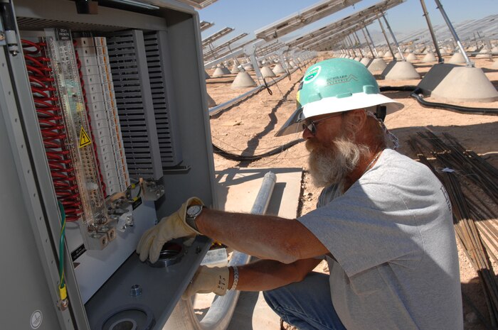 David Comer, a construction worker for Lally Steel, secures tubing onto a main control box that will house the array wiring Oct. 9, Nellis AFB, Nev.
(U.S. Air Force photo by Senior Airman Larry E. Reid Jr.)
