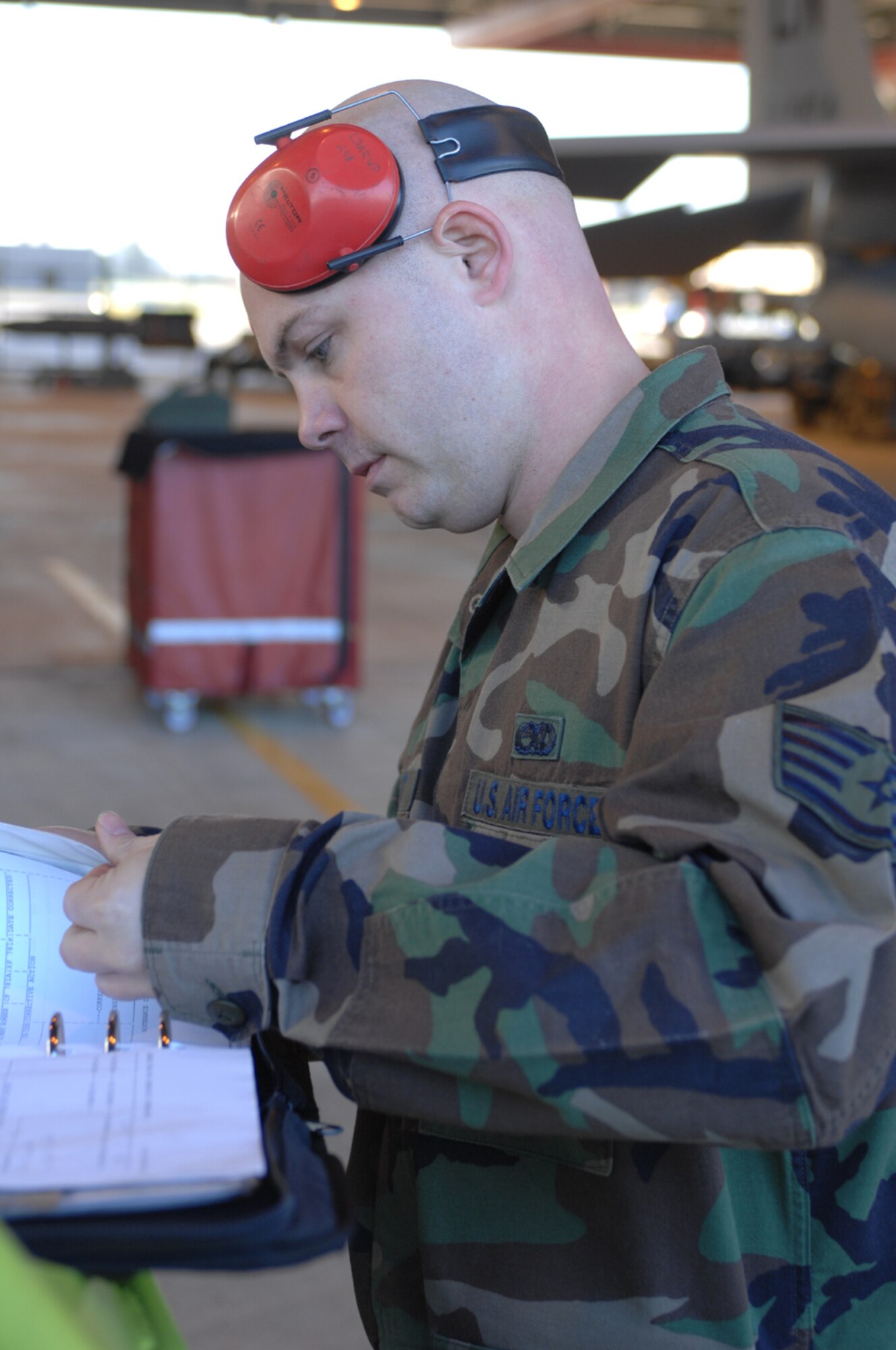 Staff Sgt. Jason Wright, a member of the 48th Aircraft Maintenance Squadron, checks over technical orders during the Oct 4 Load Crew competition at RAF Lakenheath. Sergeant Wright works with aircraft from the 494th Fighter Squadron. (U.S. Air Force photo by Staff Sgt. Christopher Campbell)