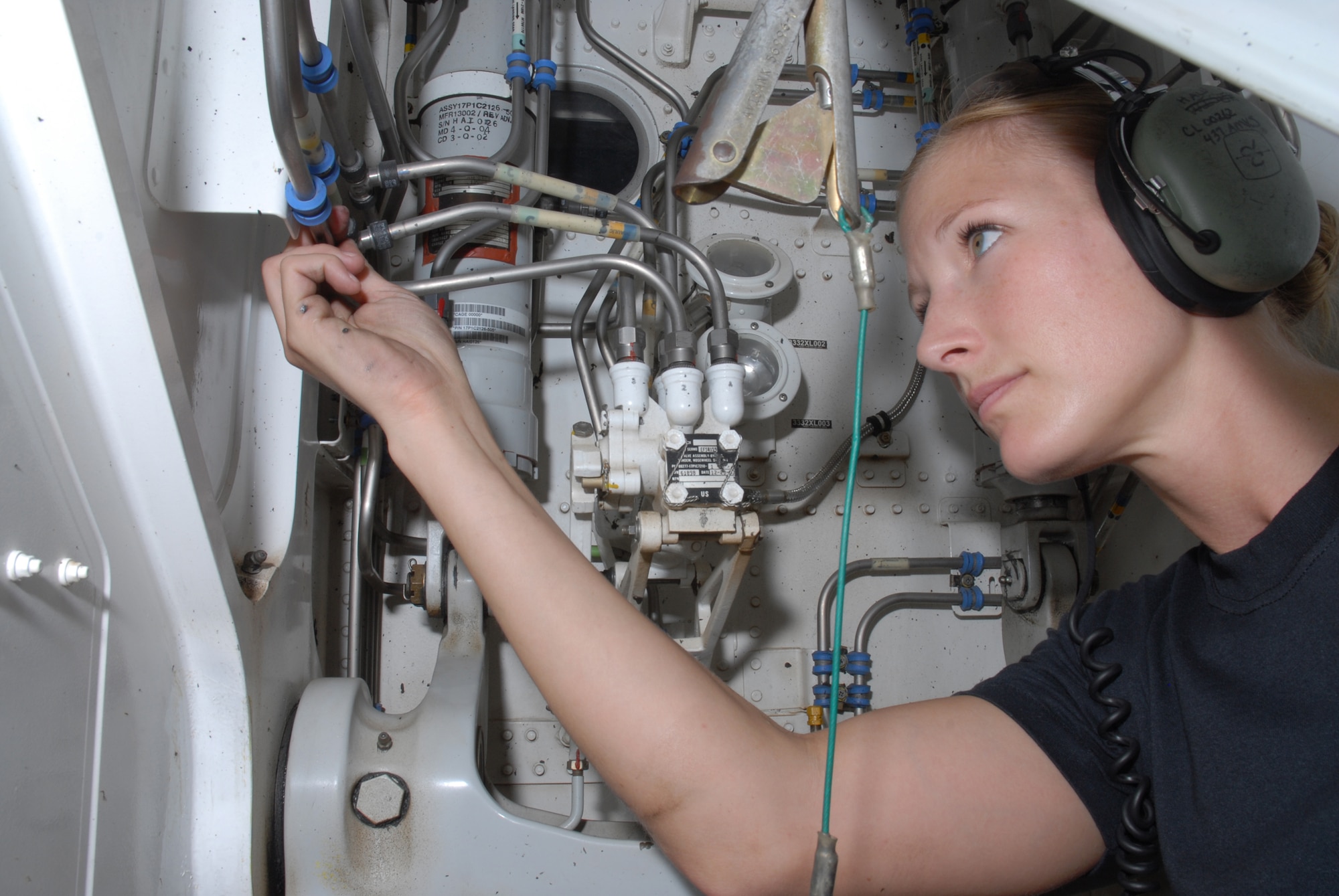 SOUTHWEST ASIA -- Staff Sergeant Sarah E. Hall, 8th Expeditionary Air Mobility Squadron, inspects a C-17 nose landing gear wheel well to ensure there are no deficiencies here Oct. 8. Sergeant Hall is deployed from Charleston Air Force Base, S.C. (U.S. Air Force photo/Staff Sergeant Douglas Olsen)