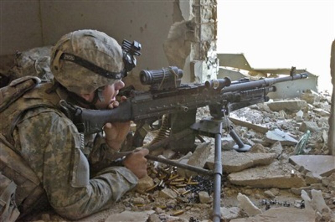U.S. Army Spc. Christopher Smith over watches a road near Tal Tasa, Iraq, on Oct. 2, 2007.  Smith is assigned to Recon Platoon, Headquarters and Headquarters Company, 4th Battalion, 9th Infantry Regiment.  