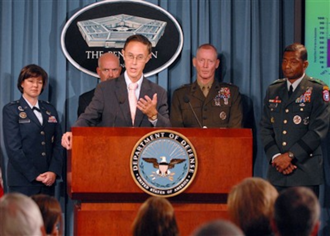 Under Secretary of Defense for Personnel and Readiness David S. Chu responds to a reporter's question during a press briefing on the latest recruiting and retention figures for the military services as recruiting service representatives (left to right) Brig. Gen. Suzanne Vautrinot, U.S Air Force, Rear Adm. Joseph Kilkenny, U.S Navy, Maj. Gen. Richard Tryon, U.S. Marine Corps, Maj. Gen. Thomas Bostick, U.S. Army, stand by to answer further questions in the Pentagon on Oct. 10, 2007.  