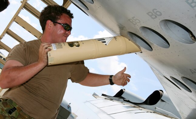 Leading Aircraftman Adrian Bradley loads sonobuoys into an AP-3C Orion Oct. 3 on the Kadena flightline. Two AP-3C Orions from 11 Squadron, Adelaide, Australia deployed to Kadena AB, Japan, to participate in a multi-lateral maritime patrol and reconnaissance operation in the West Pacific Ocean, Oct. 8–19. Number 11 Squadron crews practiced combined anti-ship and anti-submarine warfare operations with the United States Navy under the United Nations Command (Rear) Status of Forces Agreement with the government of Japan. The operation aimed to promote regional security and interoperability between participating nations. (Royal Australian Air Force photo/CPL Eddie Andrew)





