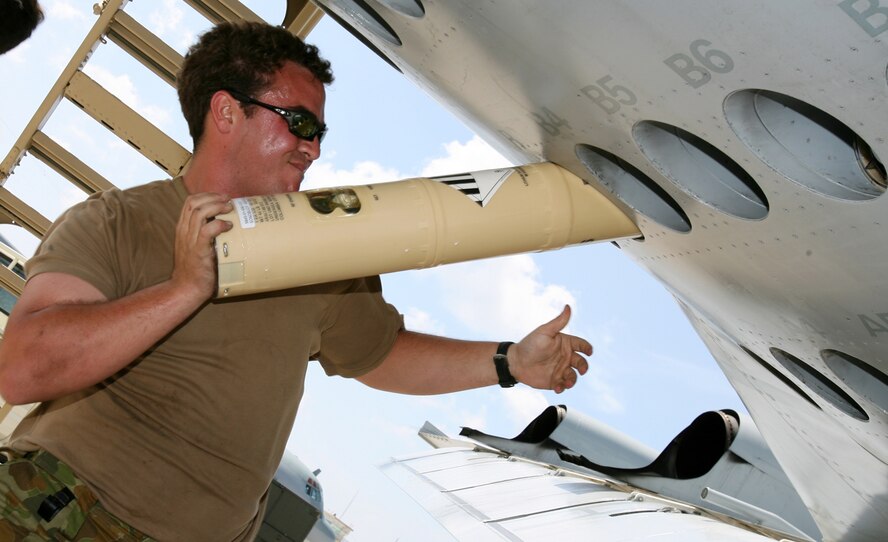 Leading Aircraftman Adrian Bradley loads sonobuoys into an AP-3C Orion Oct. 3 on the Kadena flightline. Two AP-3C Orions from 11 Squadron, Adelaide, Australia deployed to Kadena AB, Japan, to participate in a multi-lateral maritime patrol and reconnaissance operation in the West Pacific Ocean, Oct. 8–19. Number 11 Squadron crews practiced combined anti-ship and anti-submarine warfare operations with the United States Navy under the United Nations Command (Rear) Status of Forces Agreement with the government of Japan. The operation aimed to promote regional security and interoperability between participating nations. (Royal Australian Air Force photo/CPL Eddie Andrew)





