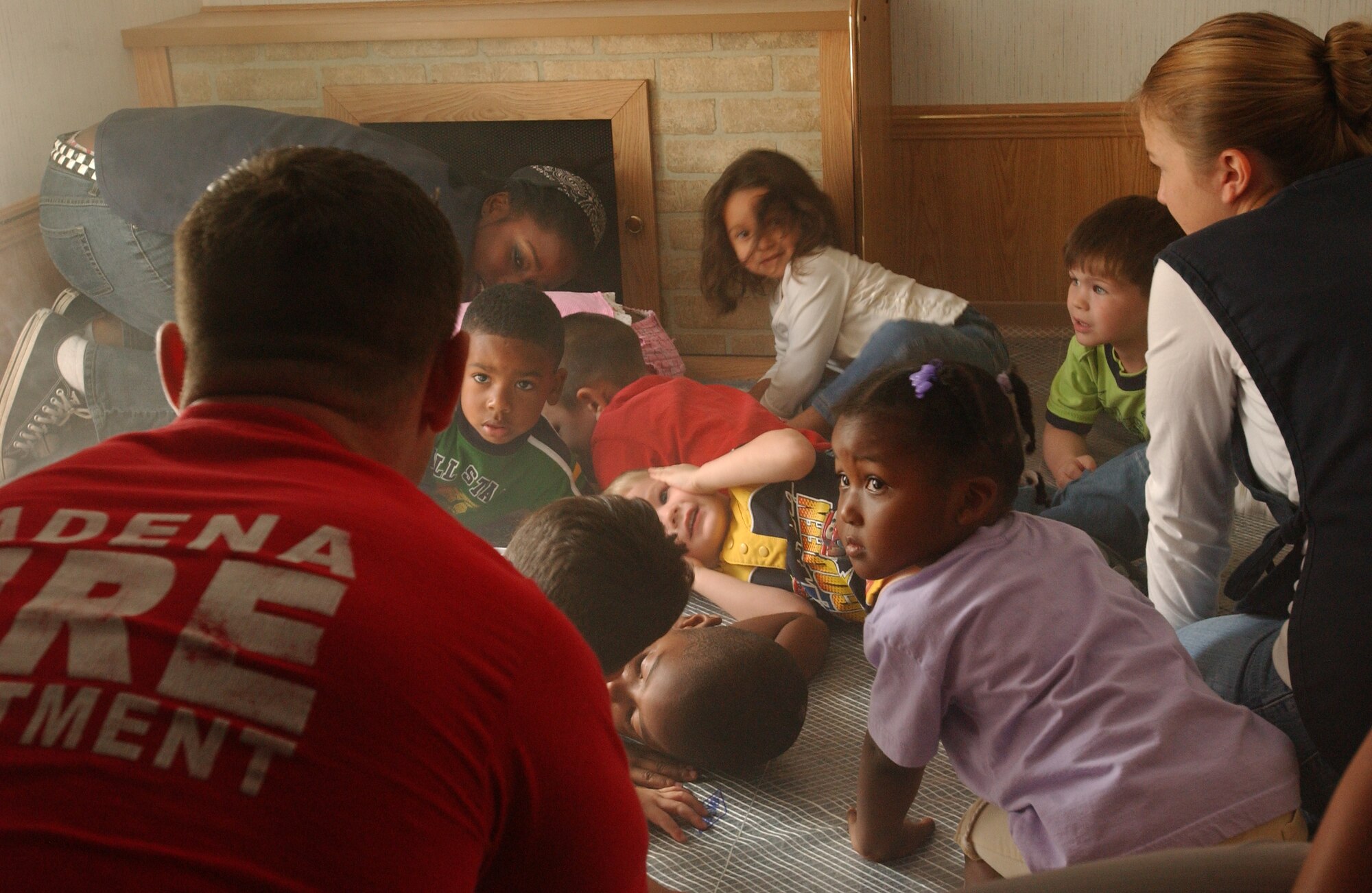 For fire prevention week, Staff Sgt. Nathan Hug from the Kadena Fire Department talks to three and 4-year-old kids at the Child Development Center about general safety Oct. 10. 
(U.S. Air Force photo/Tech. Sgt. Rey Ramon)

