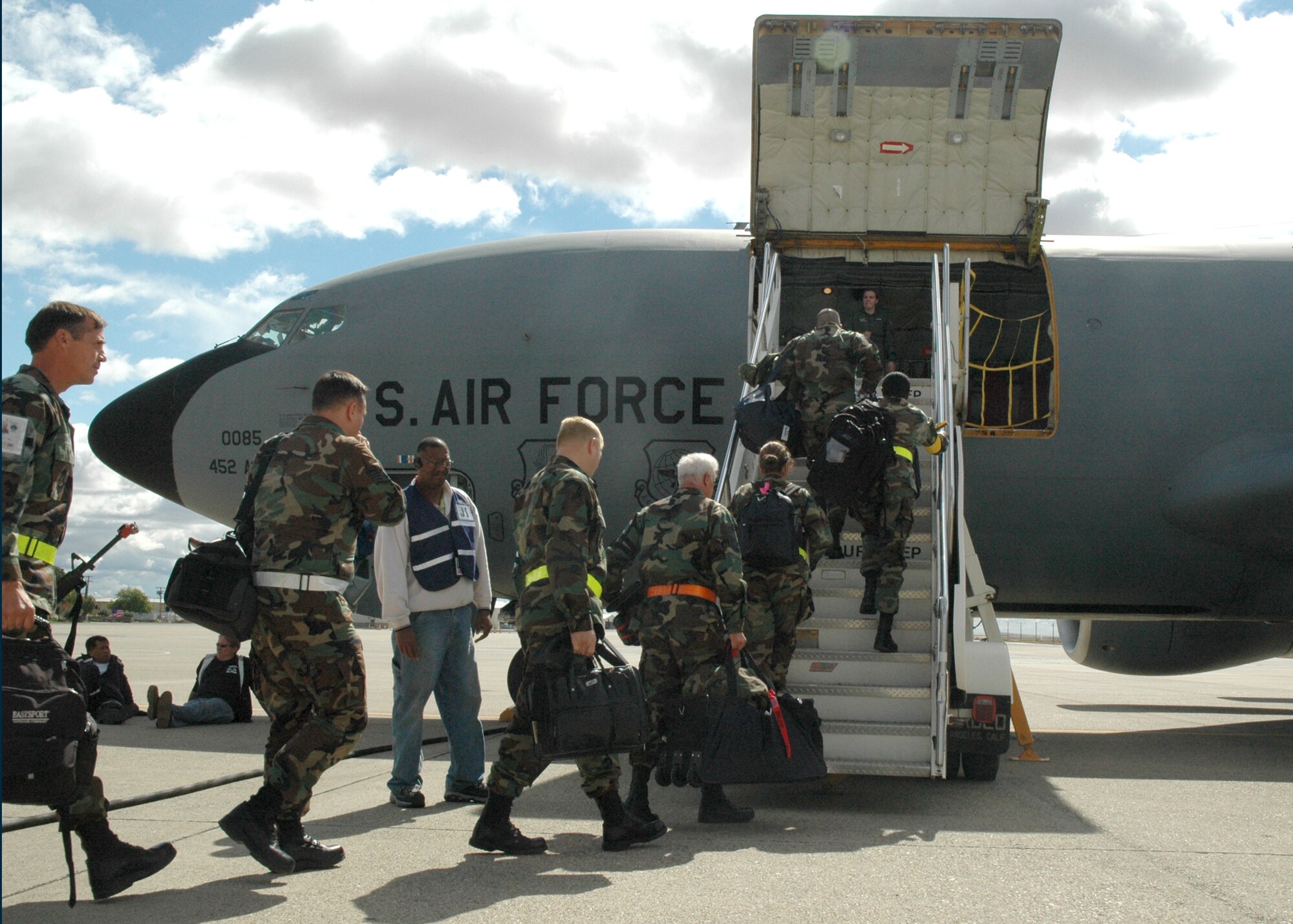 BEALE AIR FORCE BASE, Calif.--Air Force Reservists from the 940th Air Refueling Wing, Beale Air Force Base, Calif., board a KC-135 Stratotanker from the 452nd Air Mobility Wing, March Air Reserve Base, Calif., Oct. 5, 2007 for a lift to an Operational Readiness Exercise in Mississippi. The 940th, along with the 452nd and the 445th Airlift Wing, Wright-Patterson AFB, Ohio, were partners in the exercise.  The three wings will also work together during the Operational Readiness Inspection scheduled in 2008.  The exercise and inspection tests the units' readiness to deploy and operate in a wartime environment.  (U.S. Air Force photo/Stacey Knott)
