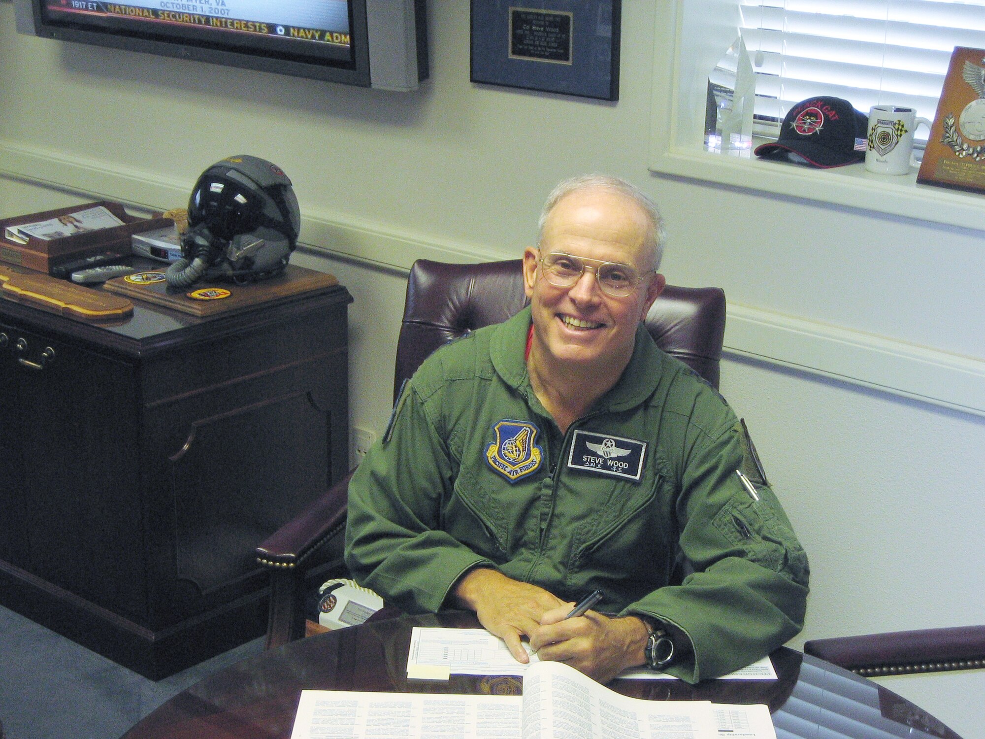 OSAN AIR BASE, Republic of Korea --  Lt. Gen. Stephen G. Wood, 7th Air Force commander, supports the 2007 Combined Federal Campaign-Overseas by filling-out his voucher to contribute and possibly win this year’s Grand Prize, a 2007 Harley Sportster.  Osan's goal is to raise $300,000 in contributions and make 100 percent contact with “Team Osan” -- more than 5,000 military members and civilians -- before the campaign closes Nov. 30. (U.S. Air Force photo by Lt. Col. Renee White)