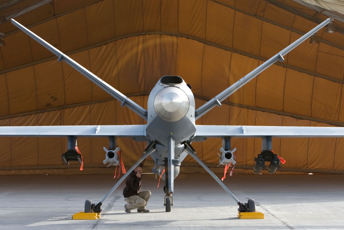 A maintenance Airman inspects an MQ-9 Reaper in Afghanistan Oct. 1. Capable of striking enemy targets with on-board weapons, the Reaper has conducted close air support and intelligence, surveillance and reconnaissance missions. (Courtesy photo)